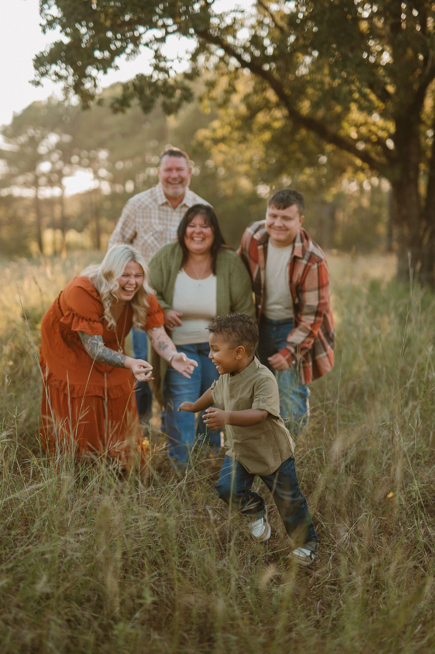 Family playing in tall grass in Fort Worth, Tx