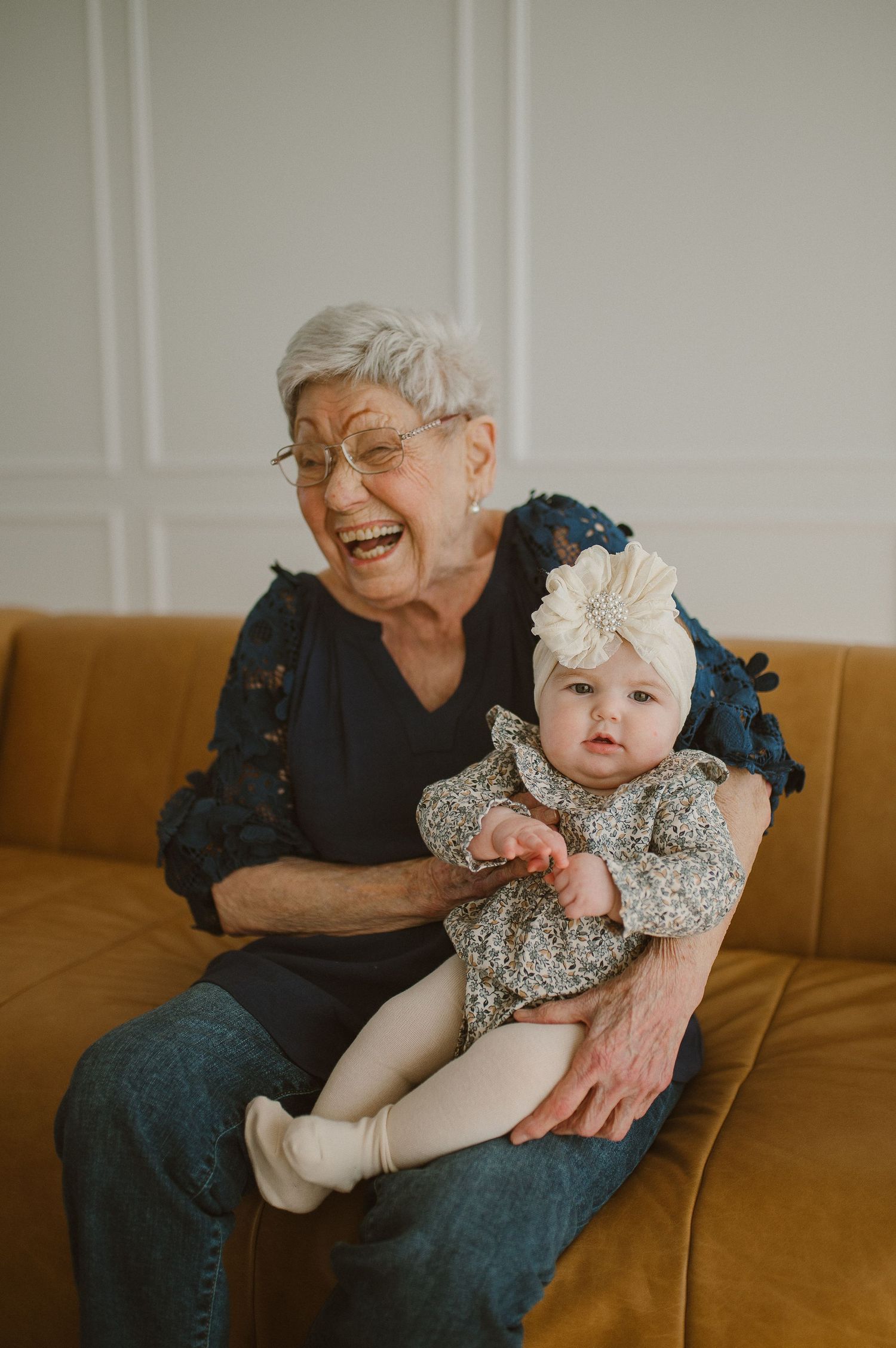 Grandma and grandbaby smiling in an indoor session in Weatherford, Tx