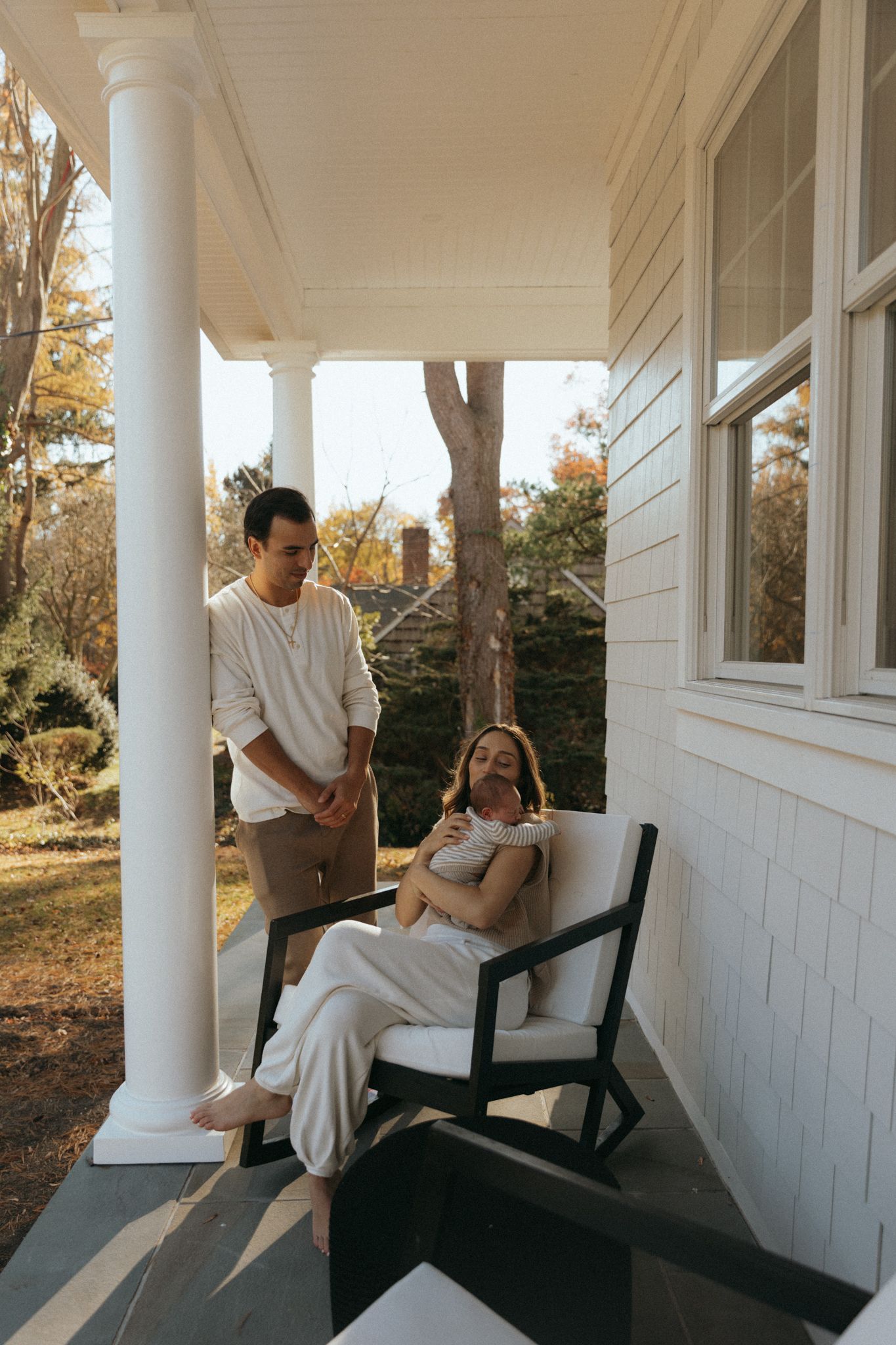 Series of candid moments on a white porch with columns at sunset.