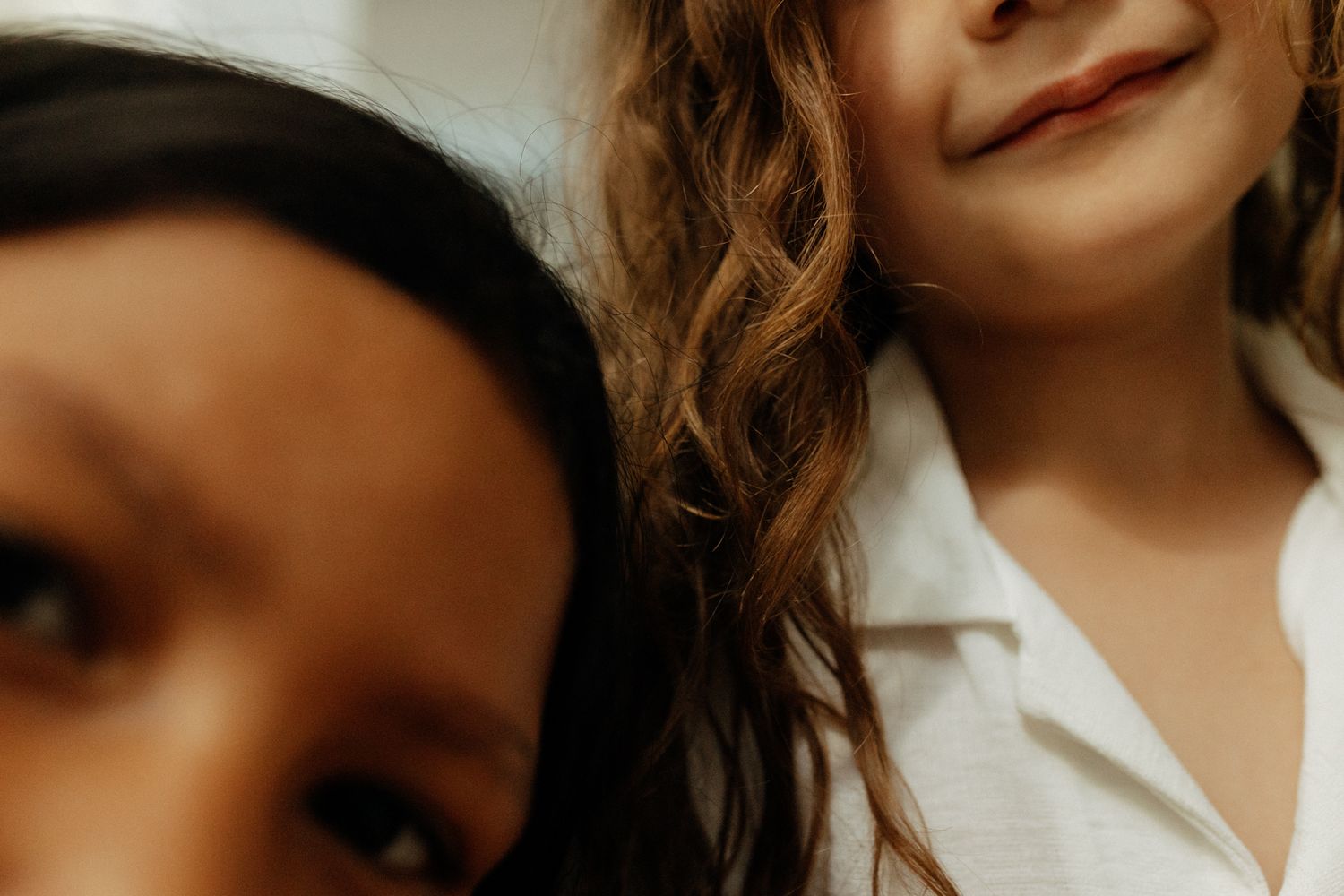 Close-up cropped portrait showing joyful expressions and smiles.