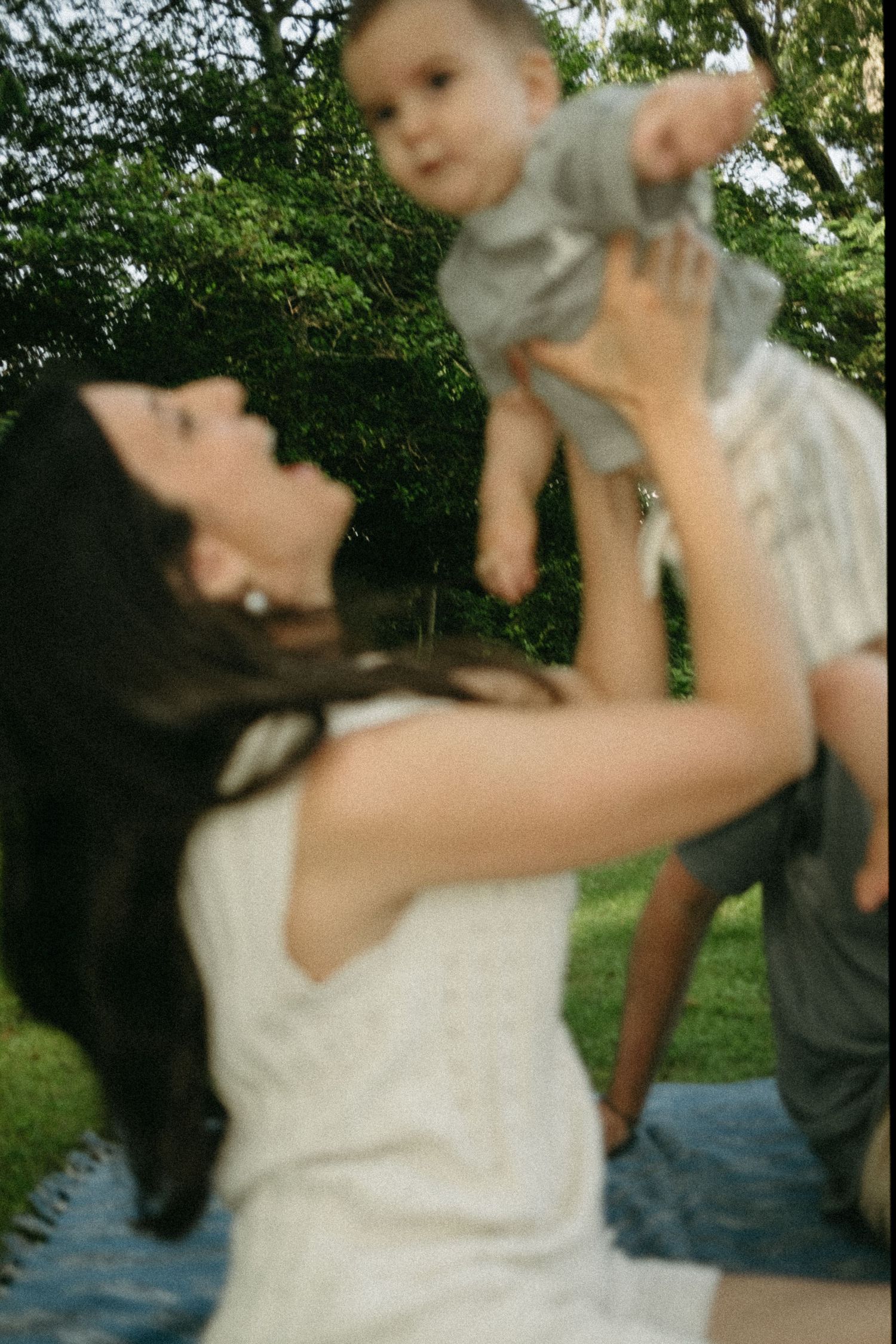 Candid outdoor family moment captured in a series of blurred motion shots.