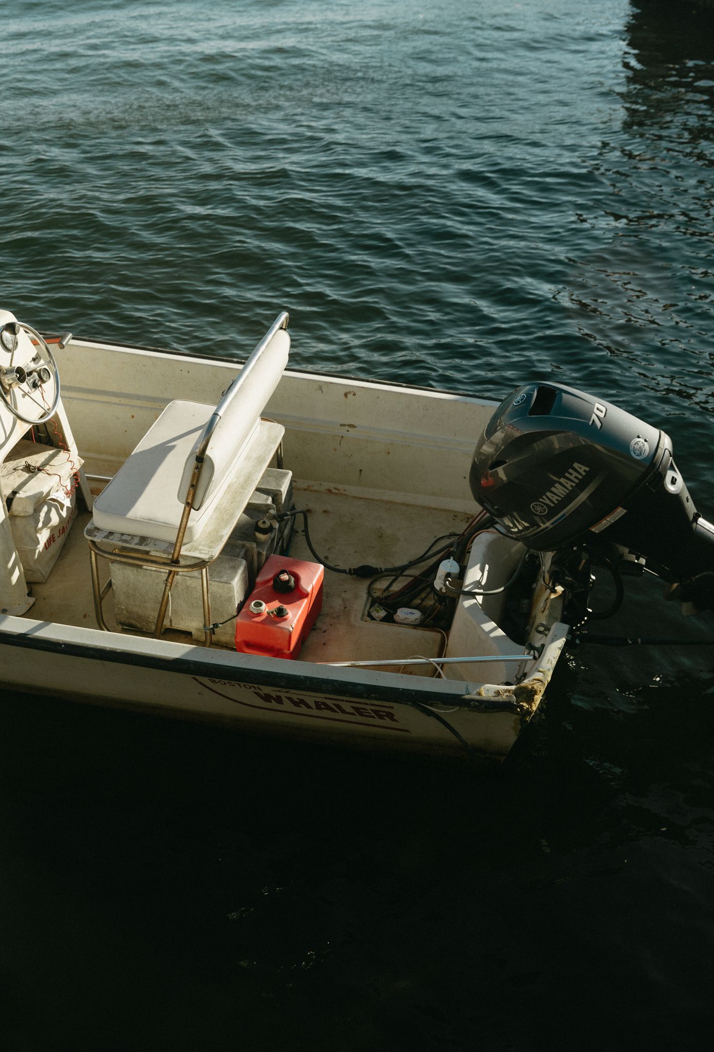 Small motorboat with equipment and gear visible from above.