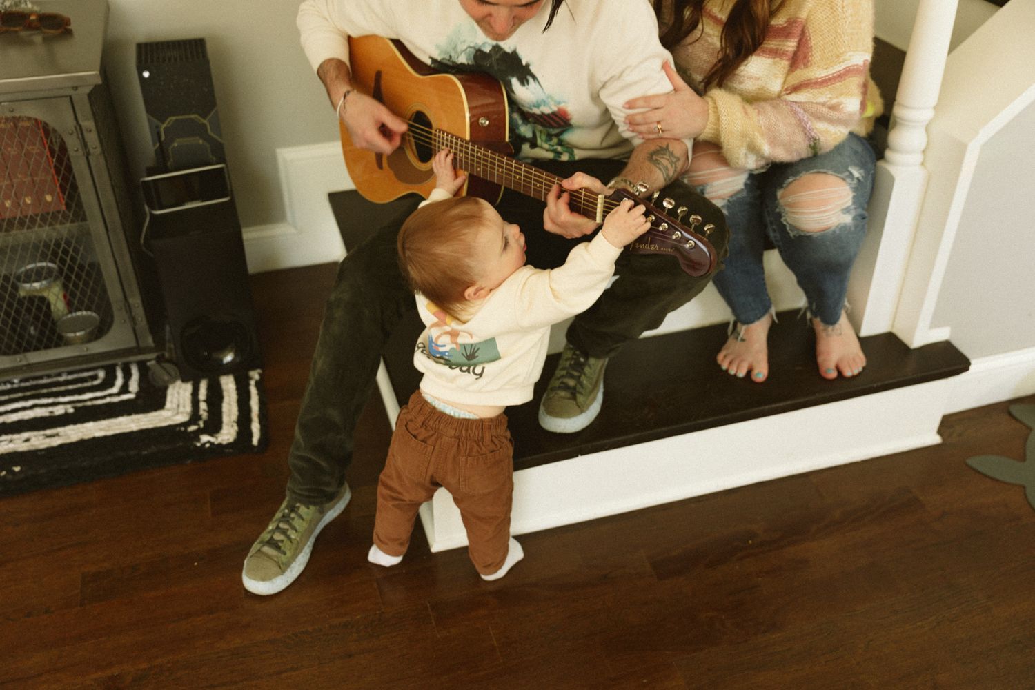 Series of images showing a person sitting on a wooden floor with a guitar.