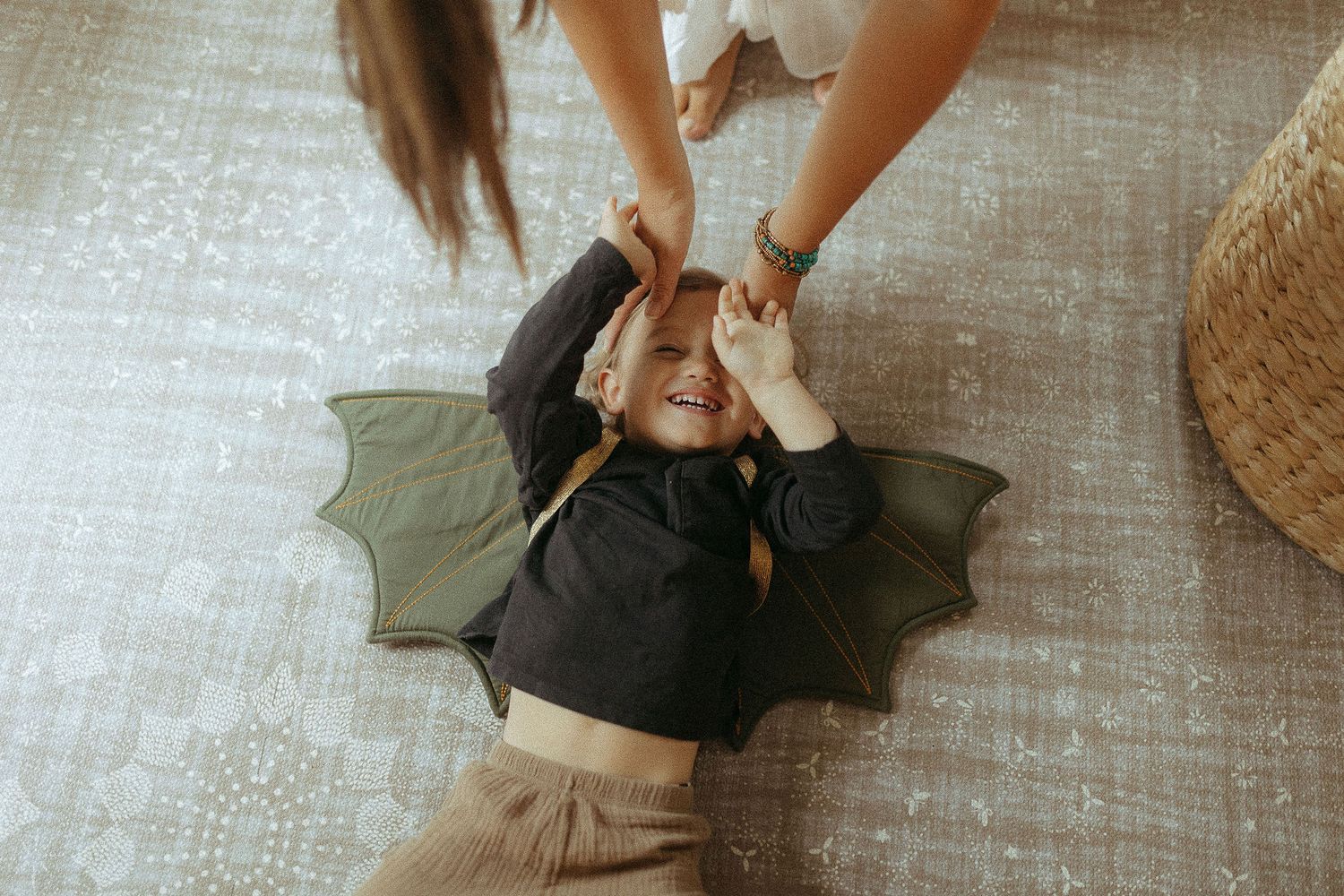 Candid moments of playful interaction on a textured floor.