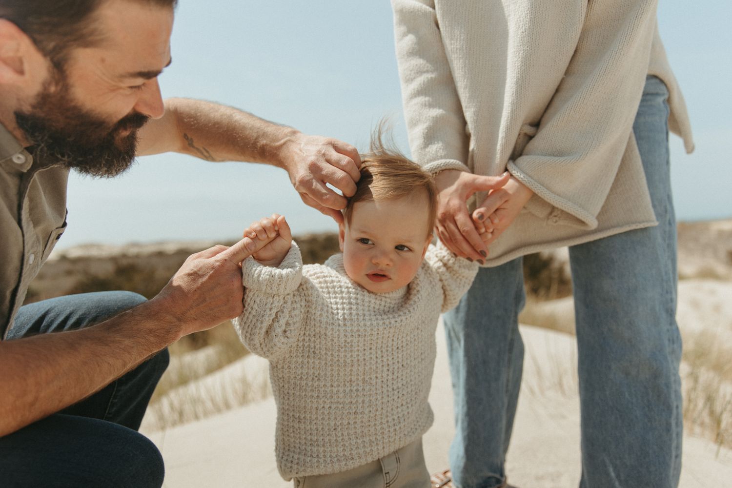 A joyful family moment captured in a series of candid photos on a sunny beach.