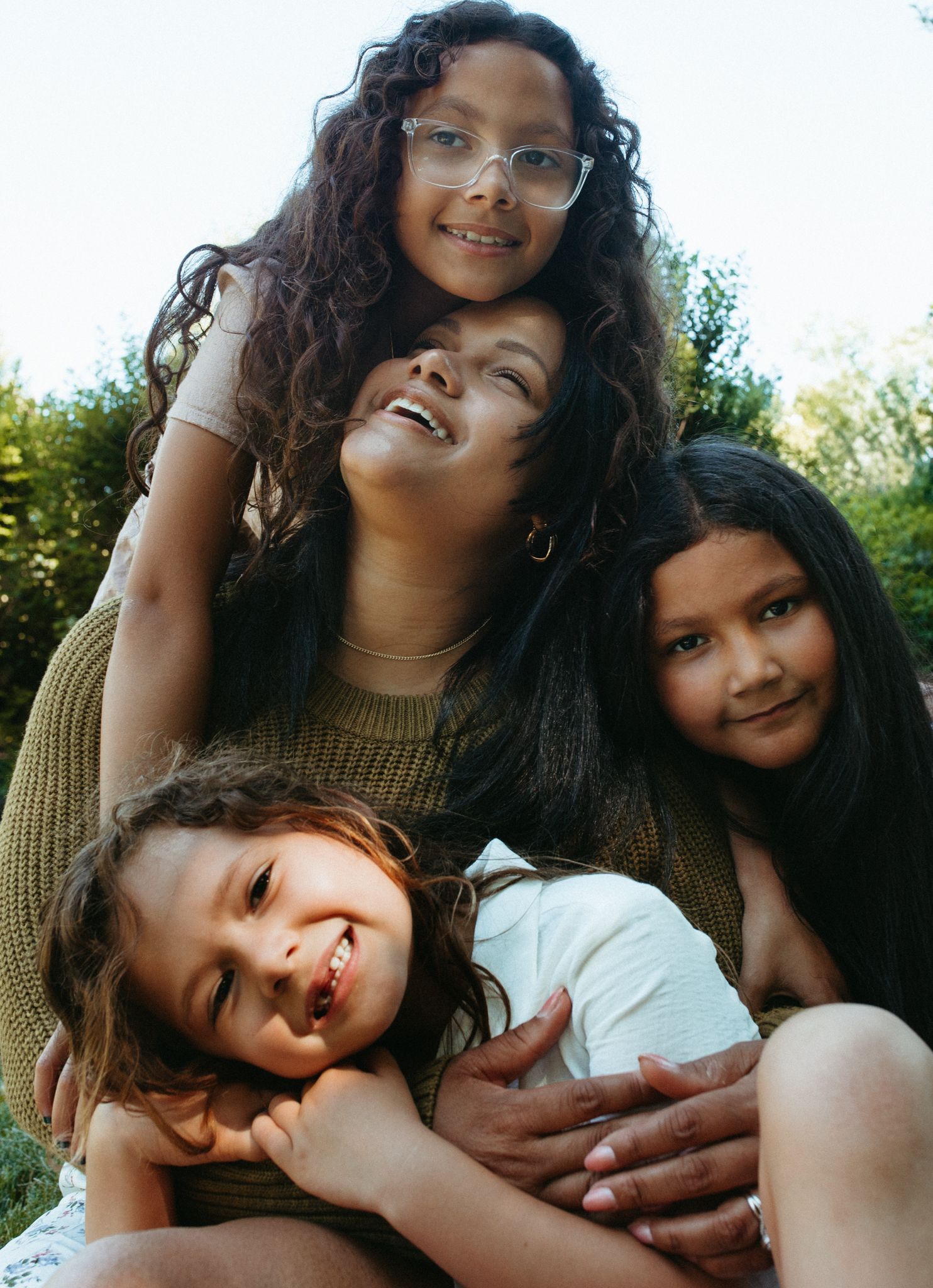 A collection of warm outdoor photos showing tender family moments in natural lighting.