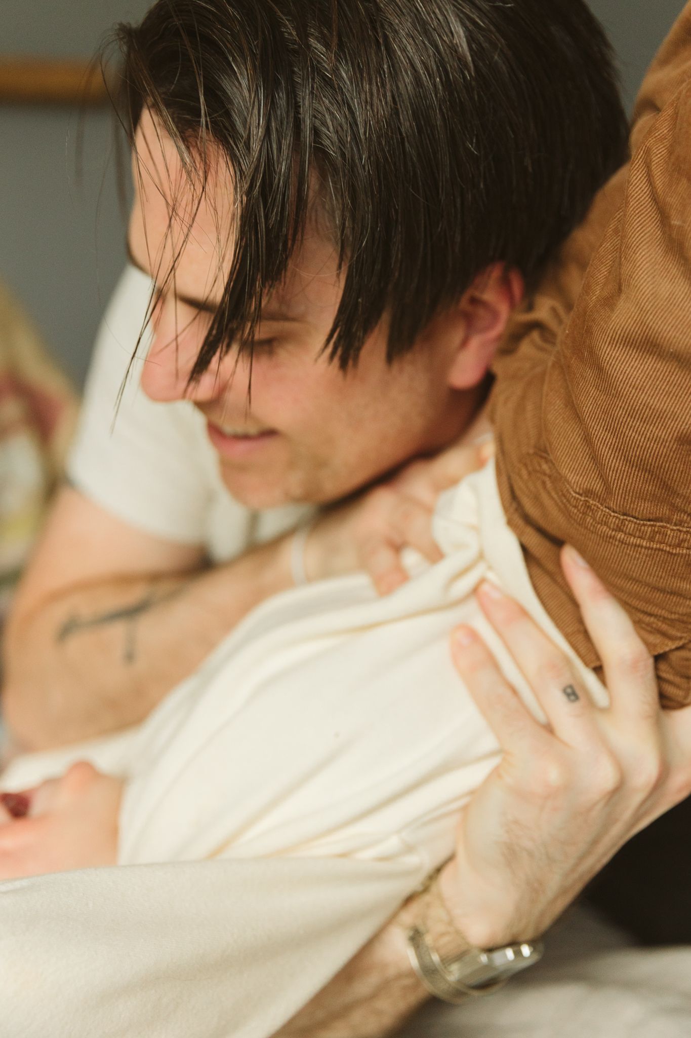 Close-up shot showing casual attire and natural lighting.