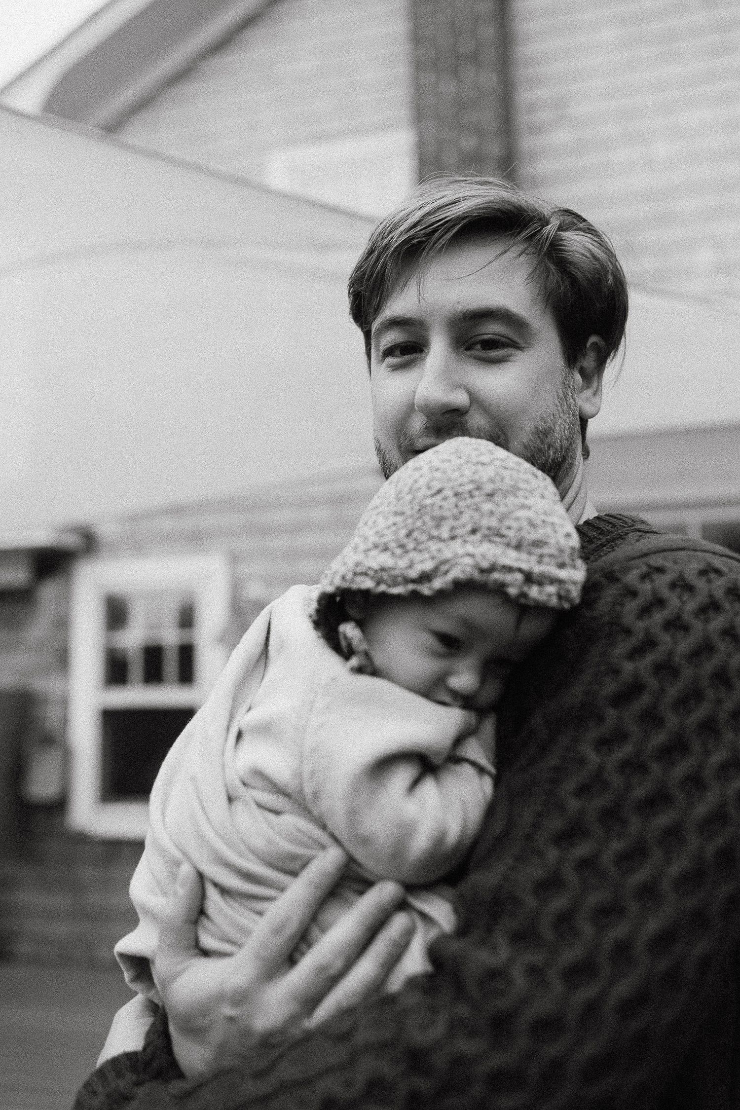 Intimate black and white portrait sequence showing tender moments.