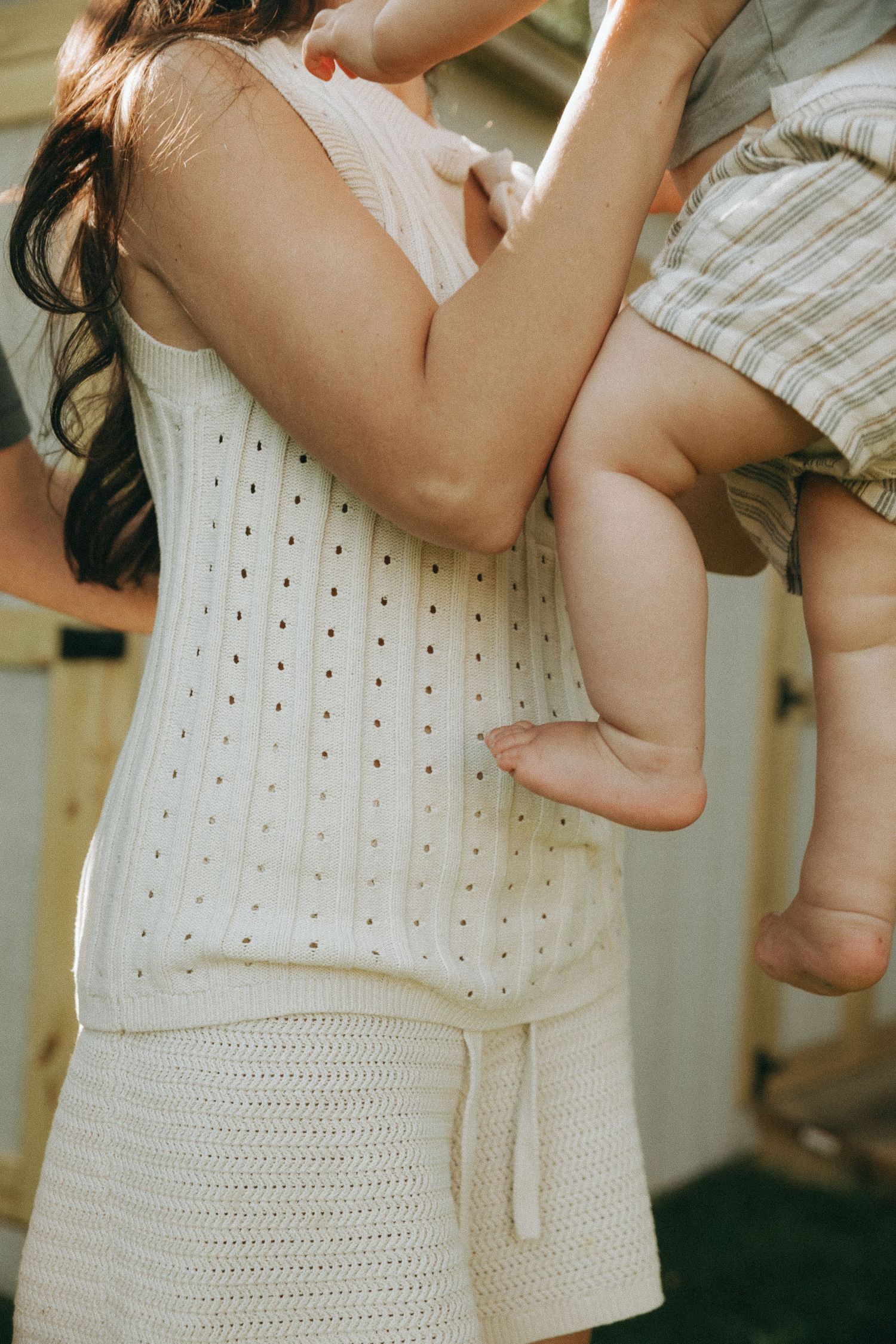 Close-up shots of white knitted fabric texture and clothing details.