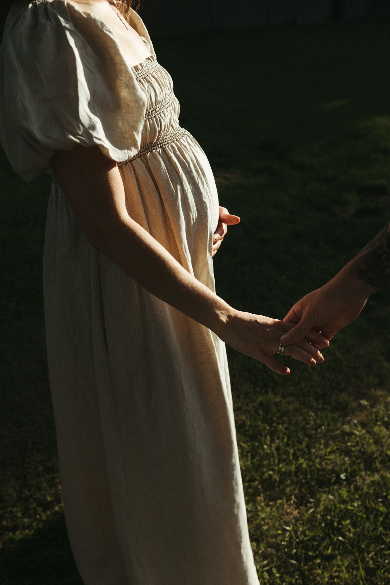 Close-up shots of a white summer dress against natural lighting and grass.