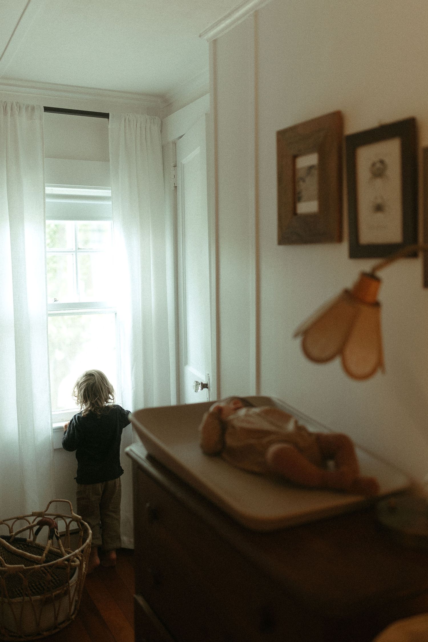 Minimalist interior shots of a bright room with wooden accents and soft natural light.