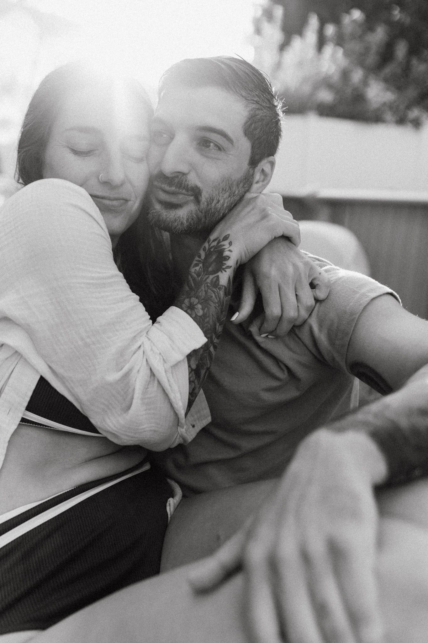 Black and white sequence of intimate moments shared outdoors.