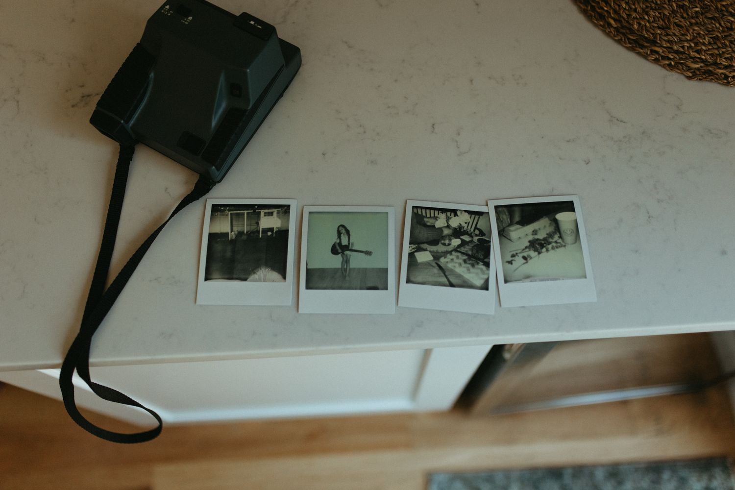polaroids displayed on counter top