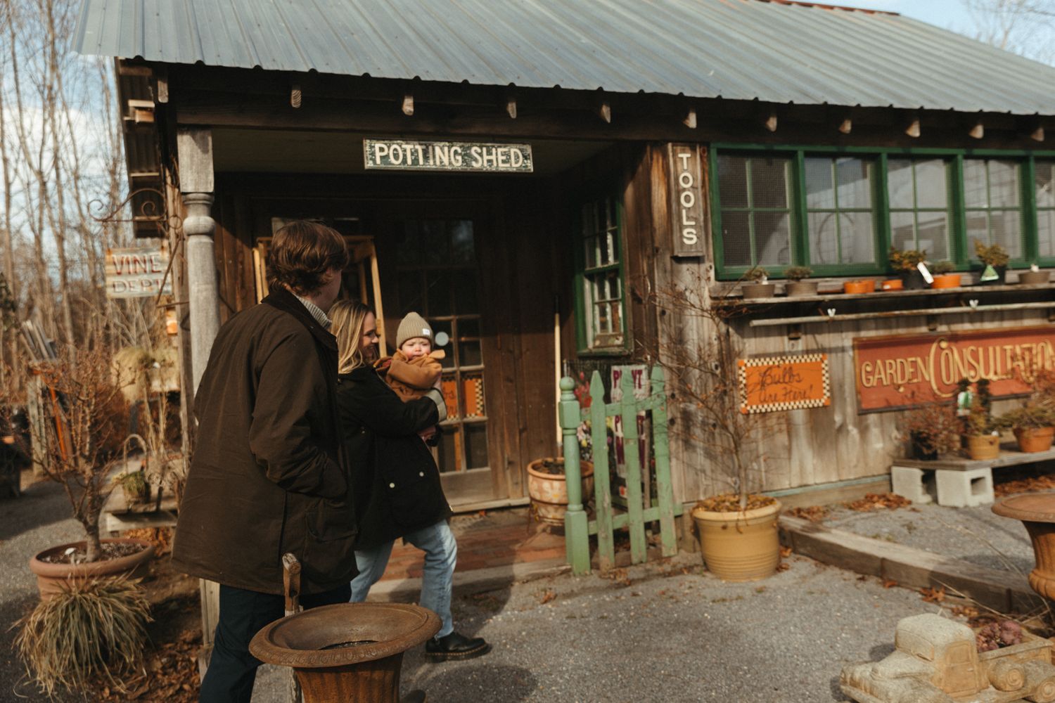 Rustic wooden storefront with vintage signage and decorative elements.
