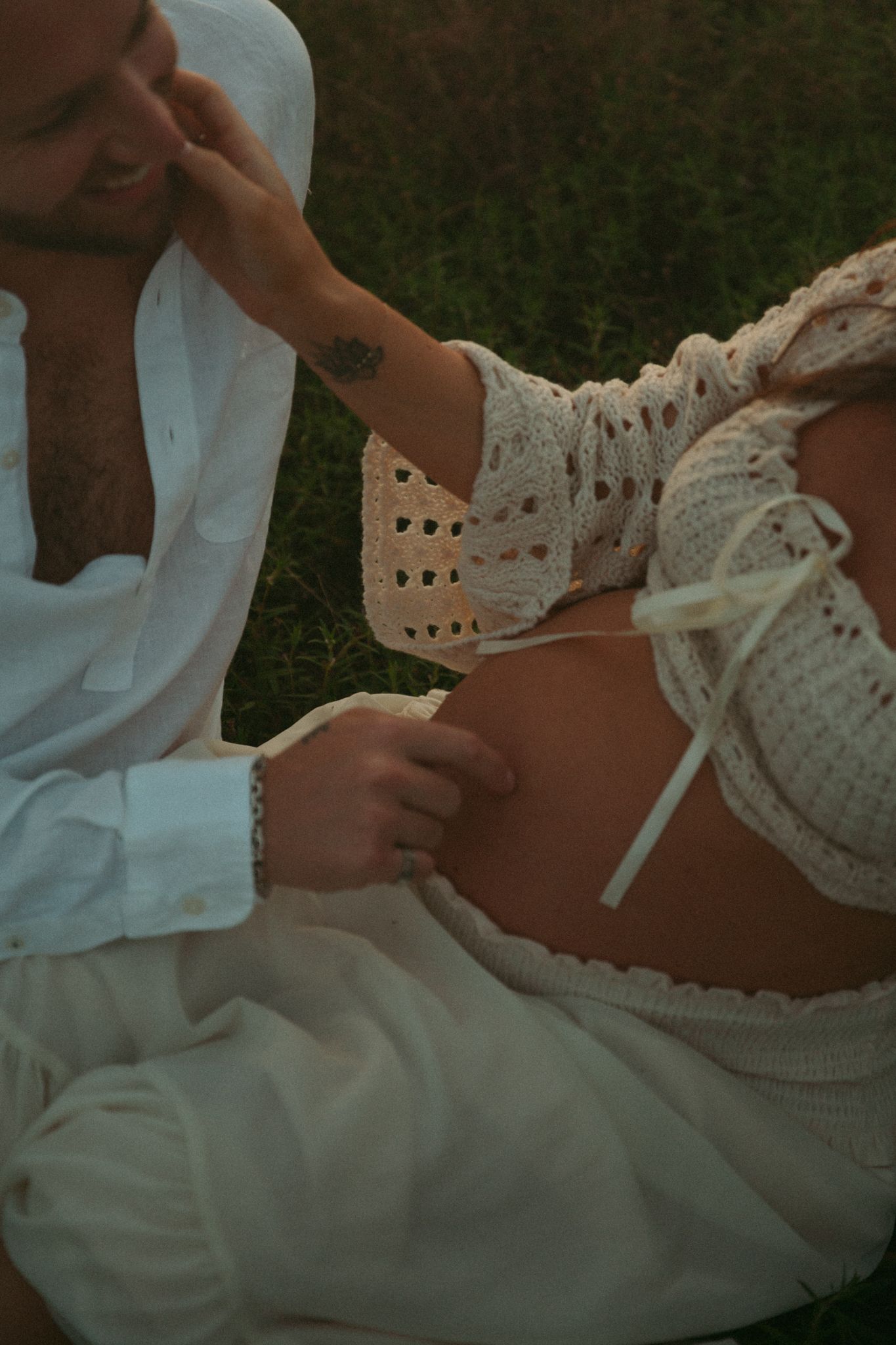 Close-up details of white lace fabric and clothing in soft natural light.