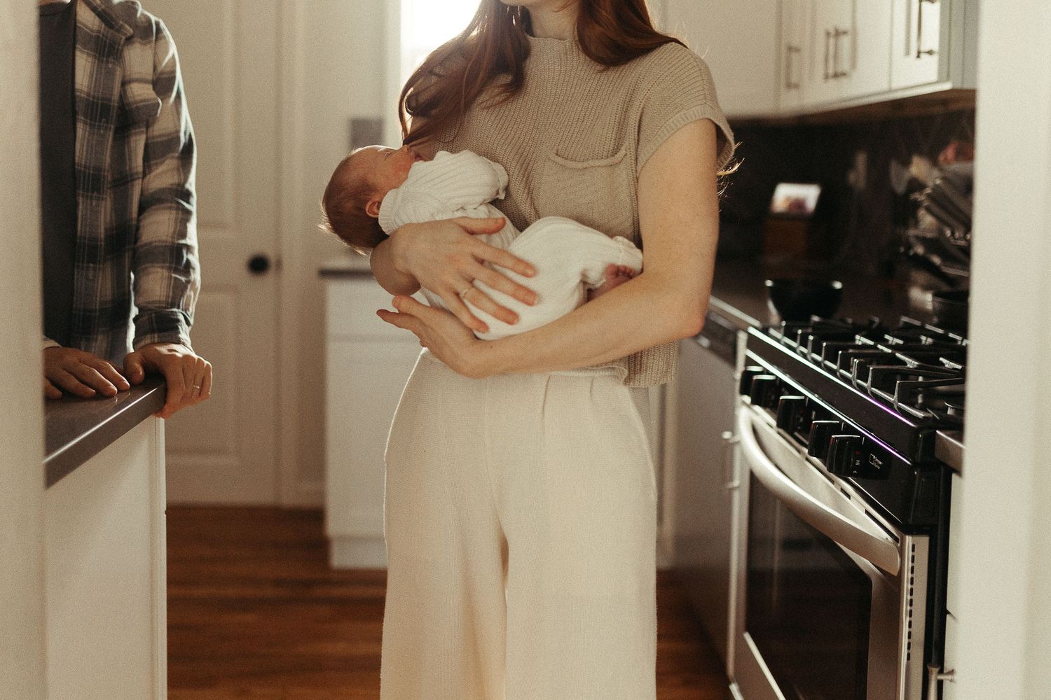 Intimate indoor photo series showing tender moments in soft natural light.