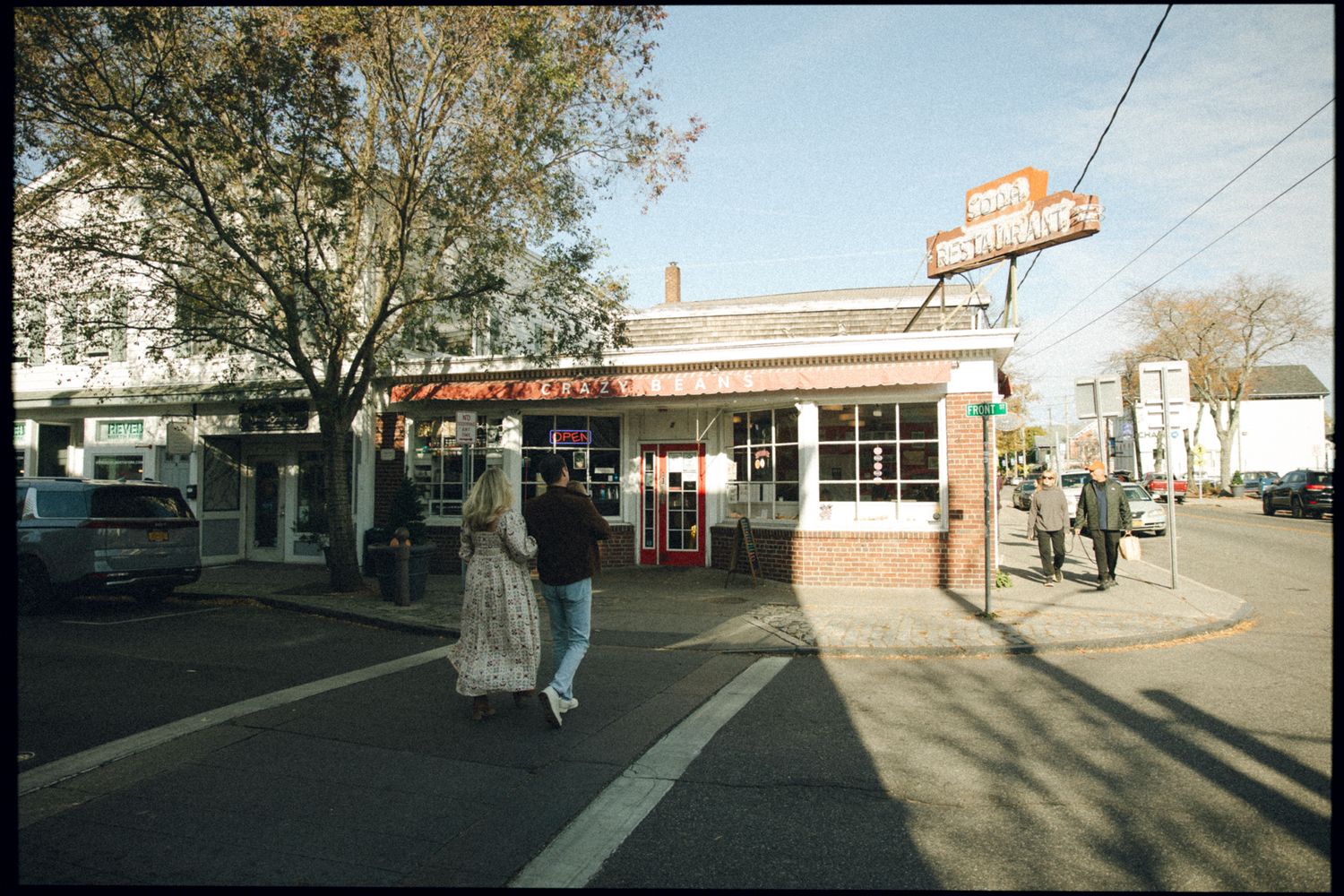 Small corner diner with vintage signage and street view.