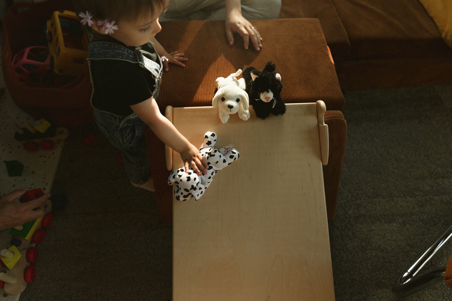 Opening a large cardboard box in a dimly lit room.