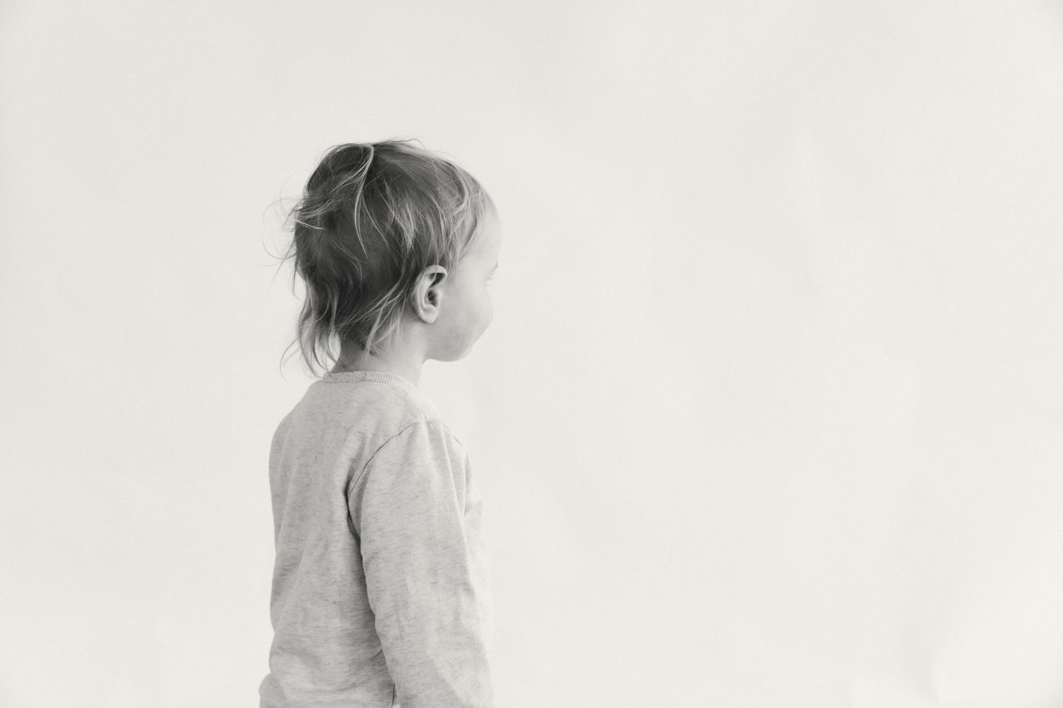 Minimalist black and white portrait series against a white background.