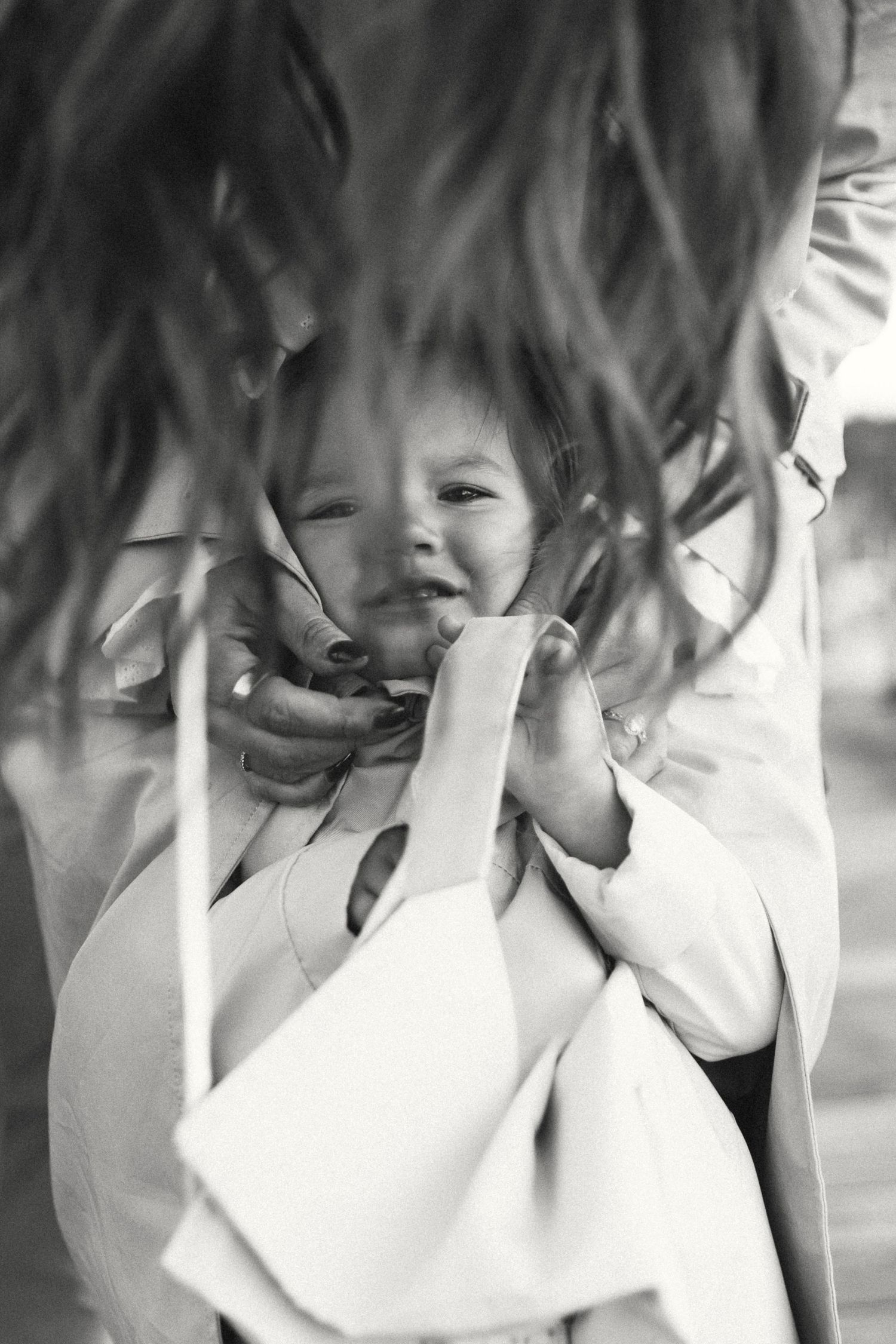 An artistic black and white close-up portrait with motion blur effects.