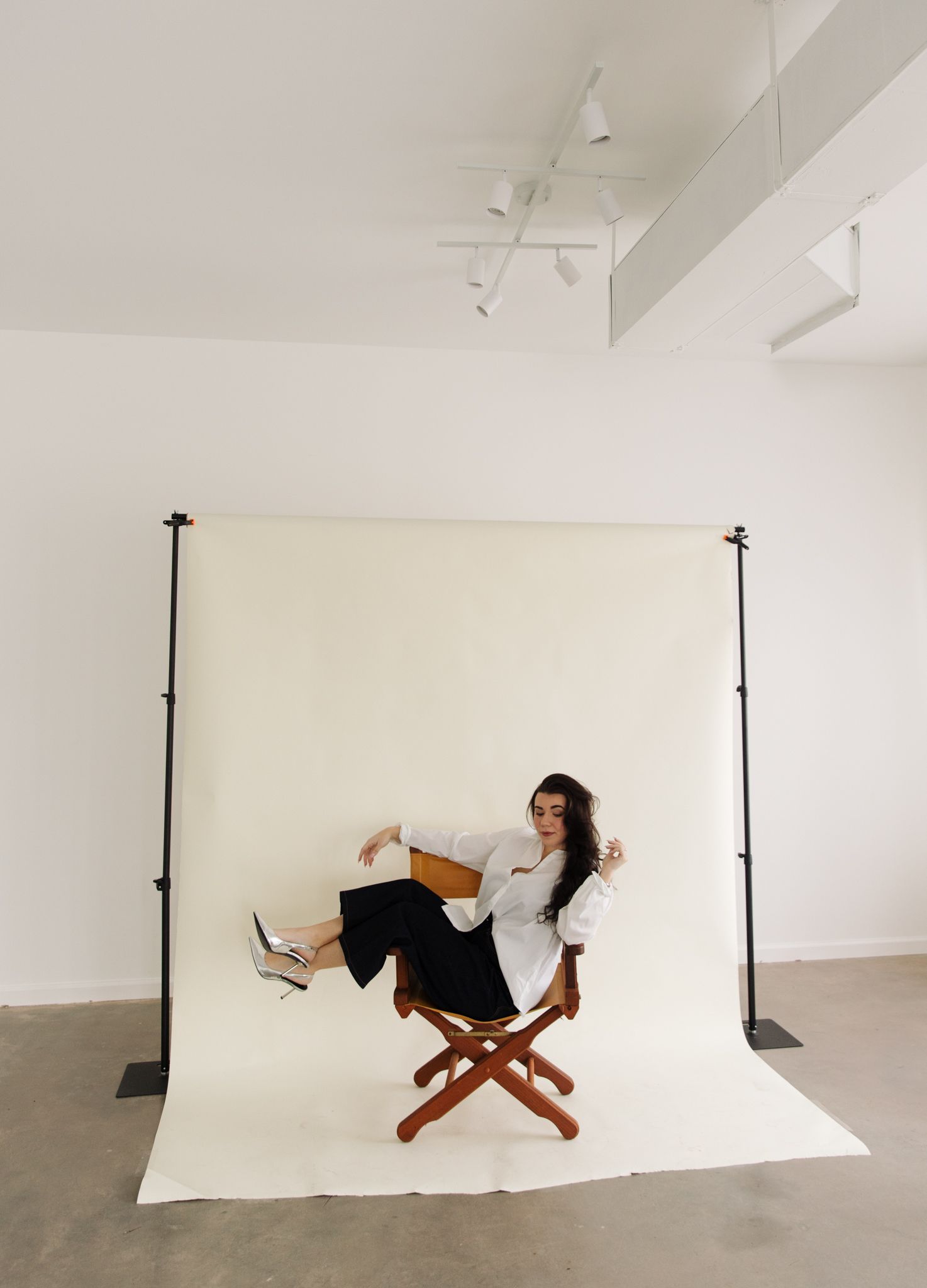 Creative studio shots showing movement and poses on a white seamless background.