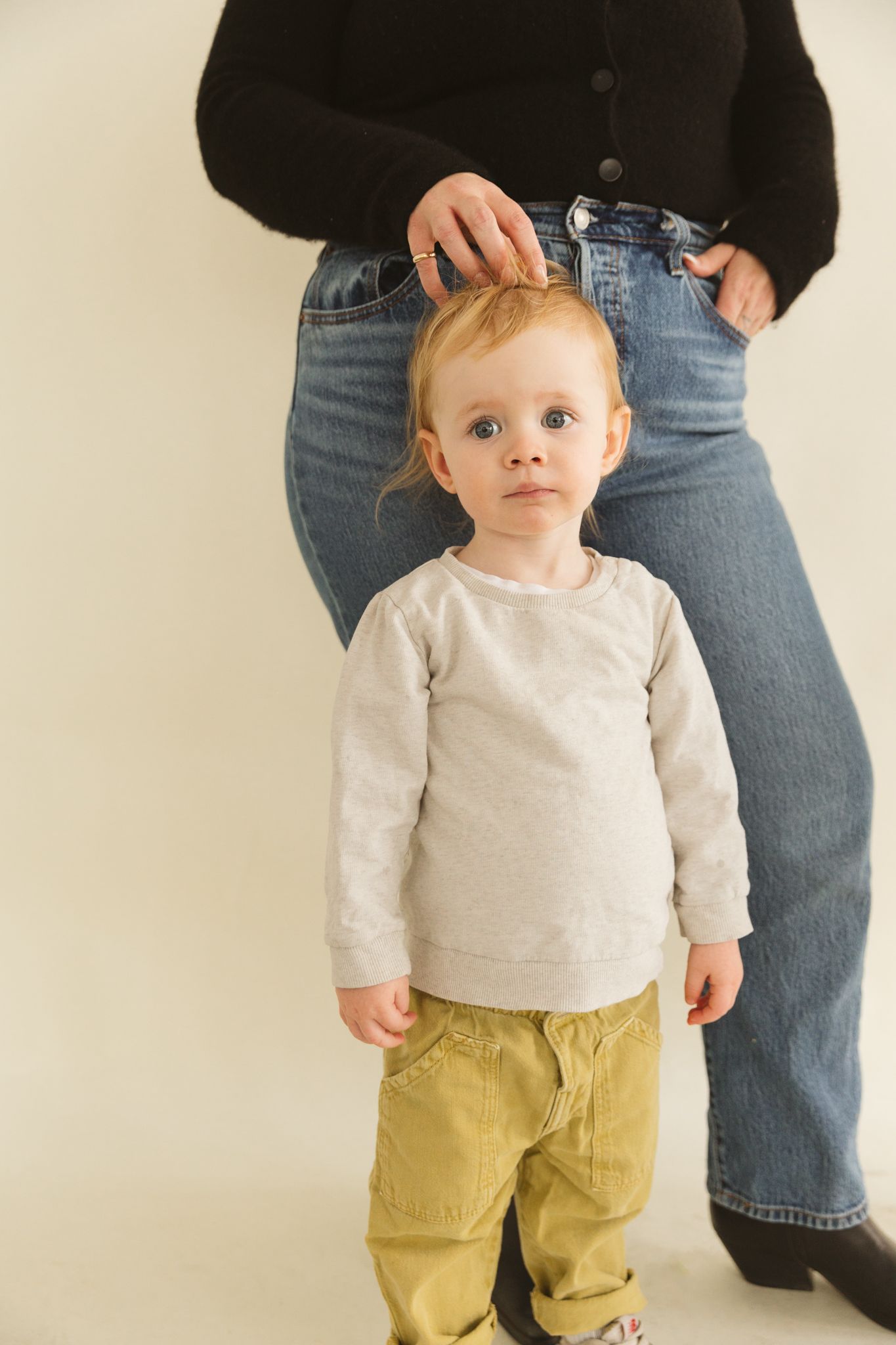 Casual portrait series showing a small child in yellow pants and white shirt.
