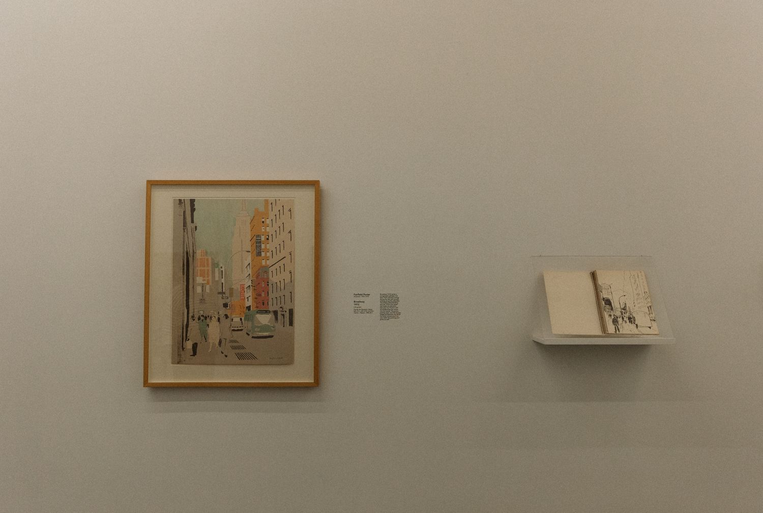 Art gallery wall displaying framed artwork in a clean, minimalist setting.