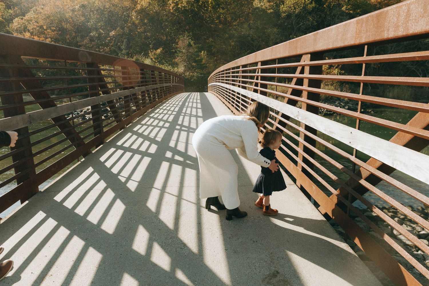 Dramatic shadows cast across wooden boardwalk in sequential photos.
