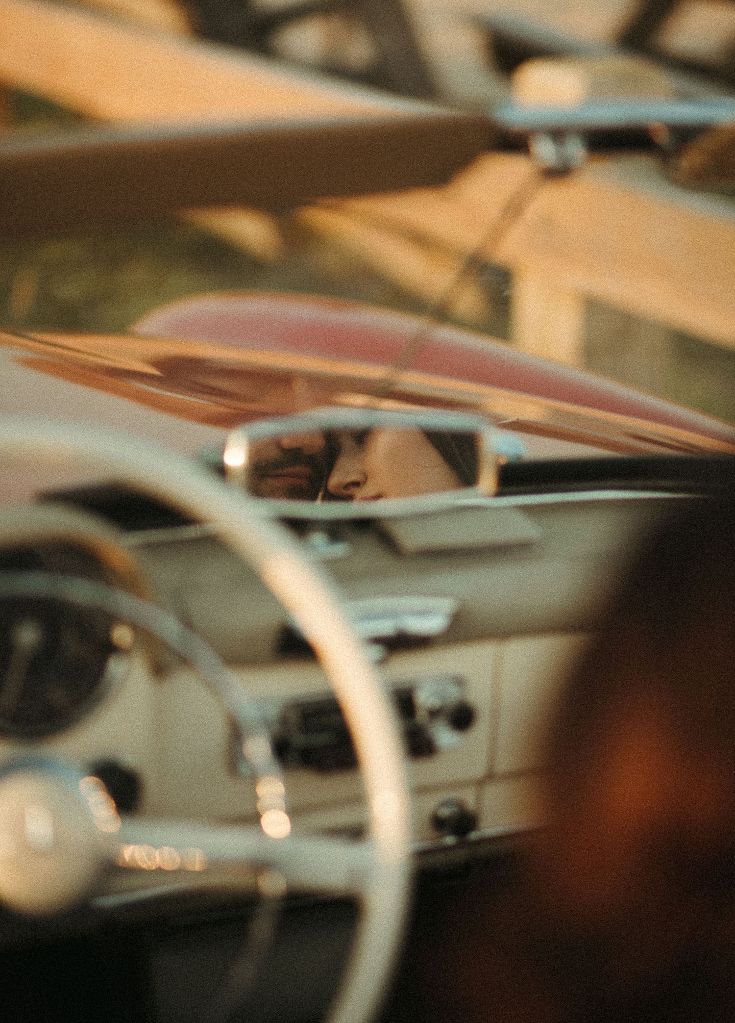 Blurred vintage car dashboard details shown in an artistic close-up shot.