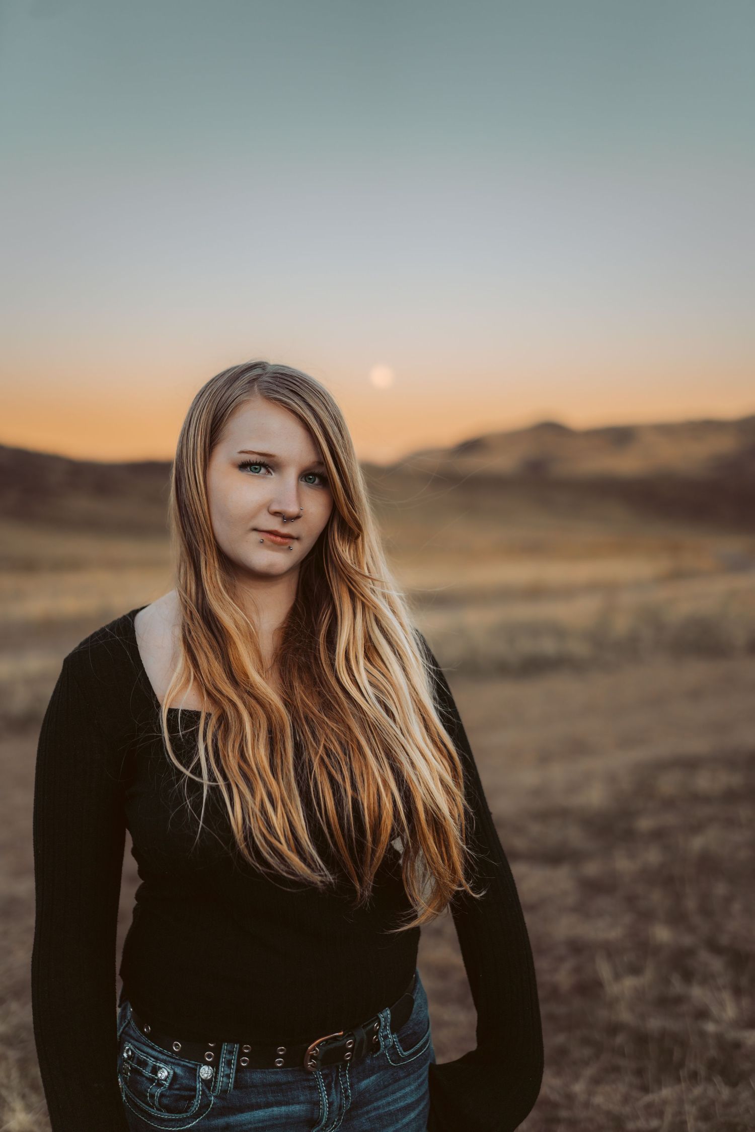 Senior girl in the desert at twilight.