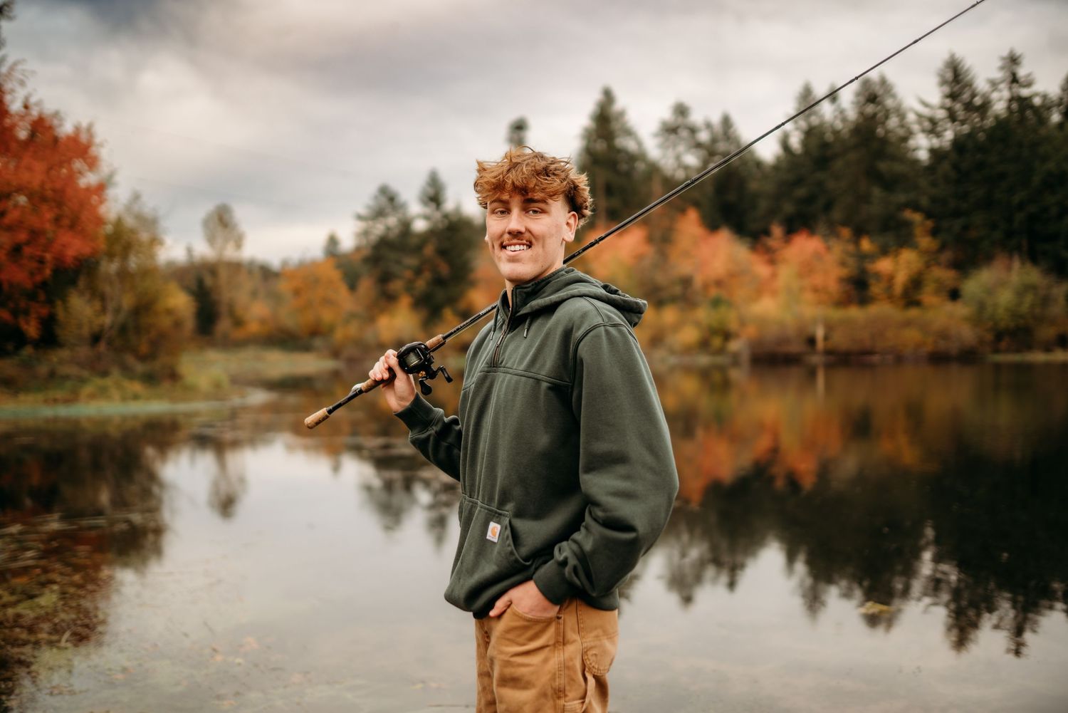 Senior boy portrait fishing outdoors in Silverton, Oregon