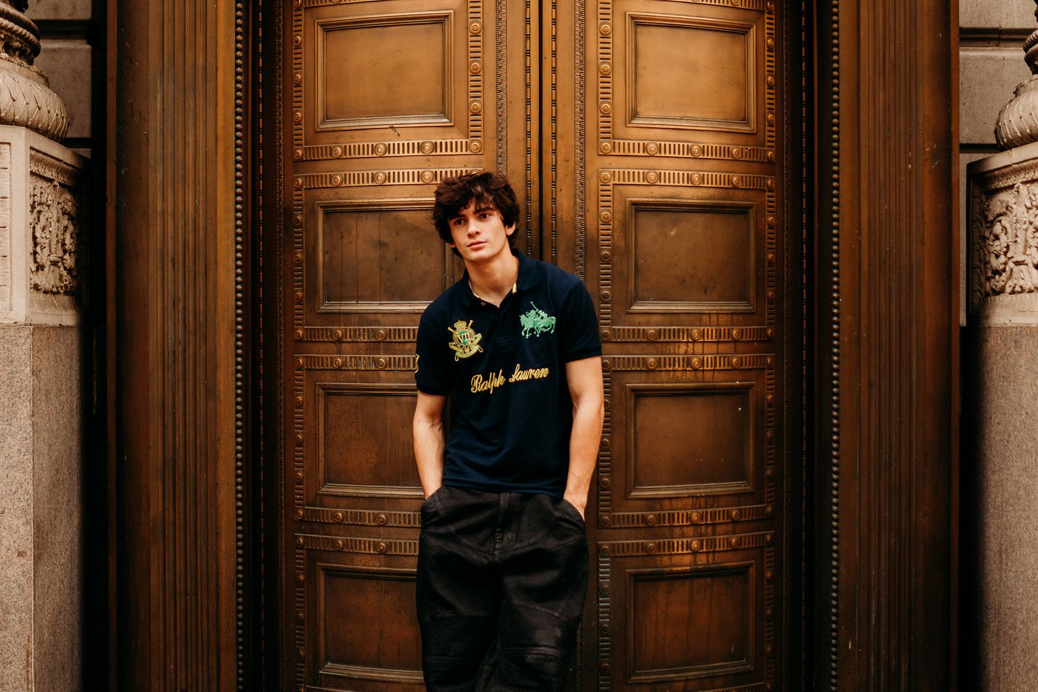 Dramatic portrait of a high school senior in an urban setting.