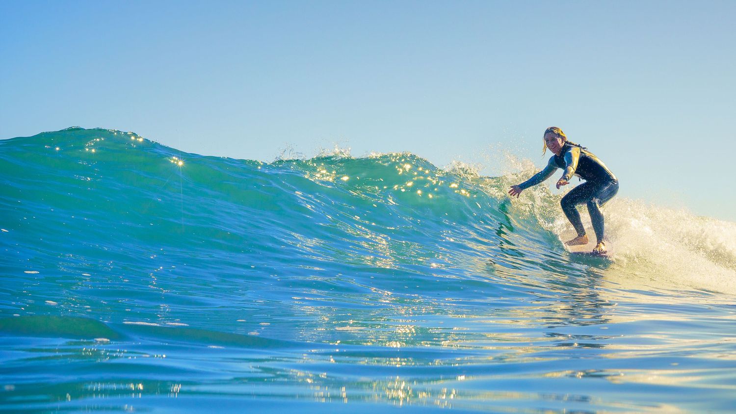 Ashley Lloyd surfing Pleasure Point in Santa Cruz, CA