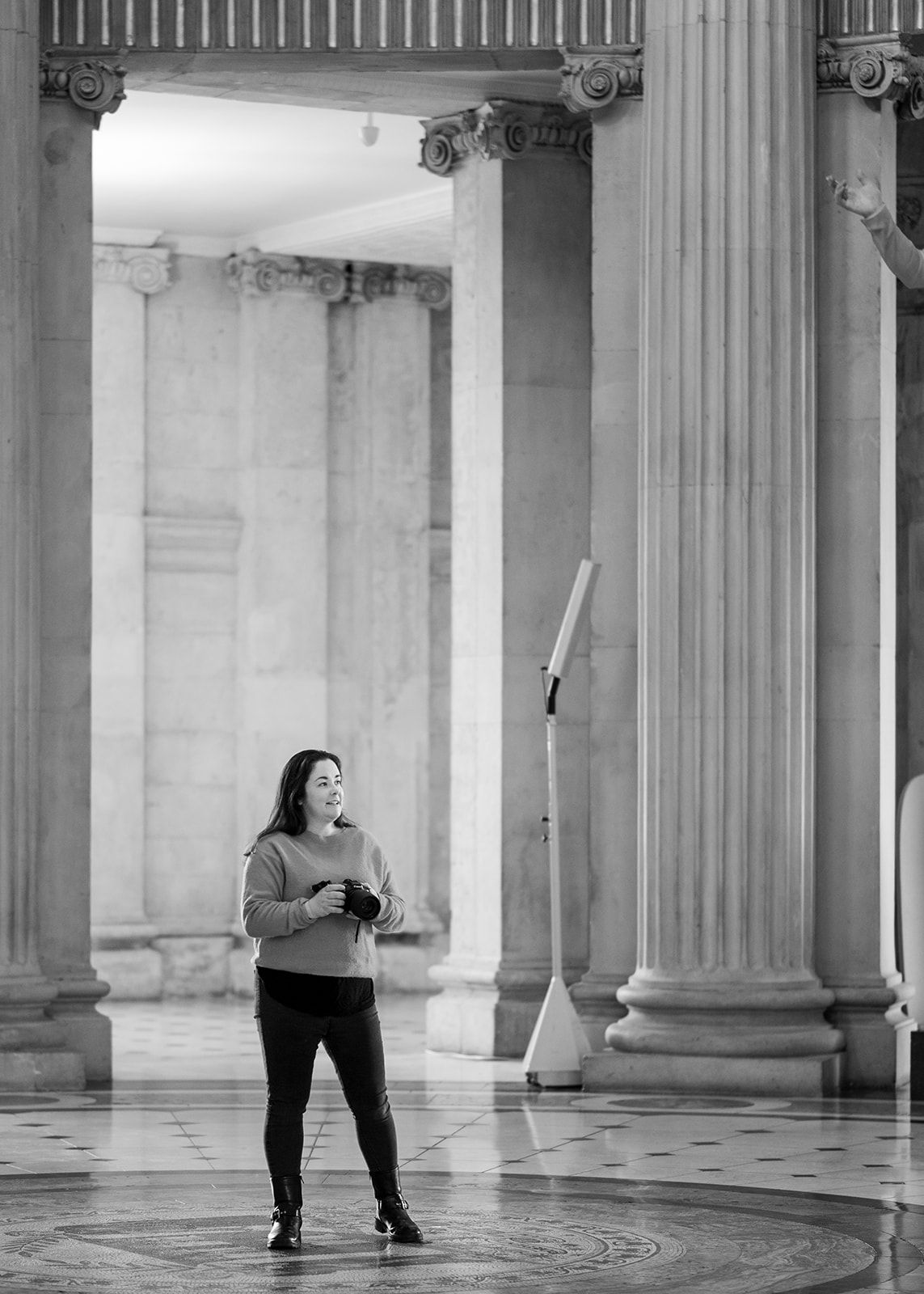 A series of photos in a classical columned hallway showing movement and dance.
