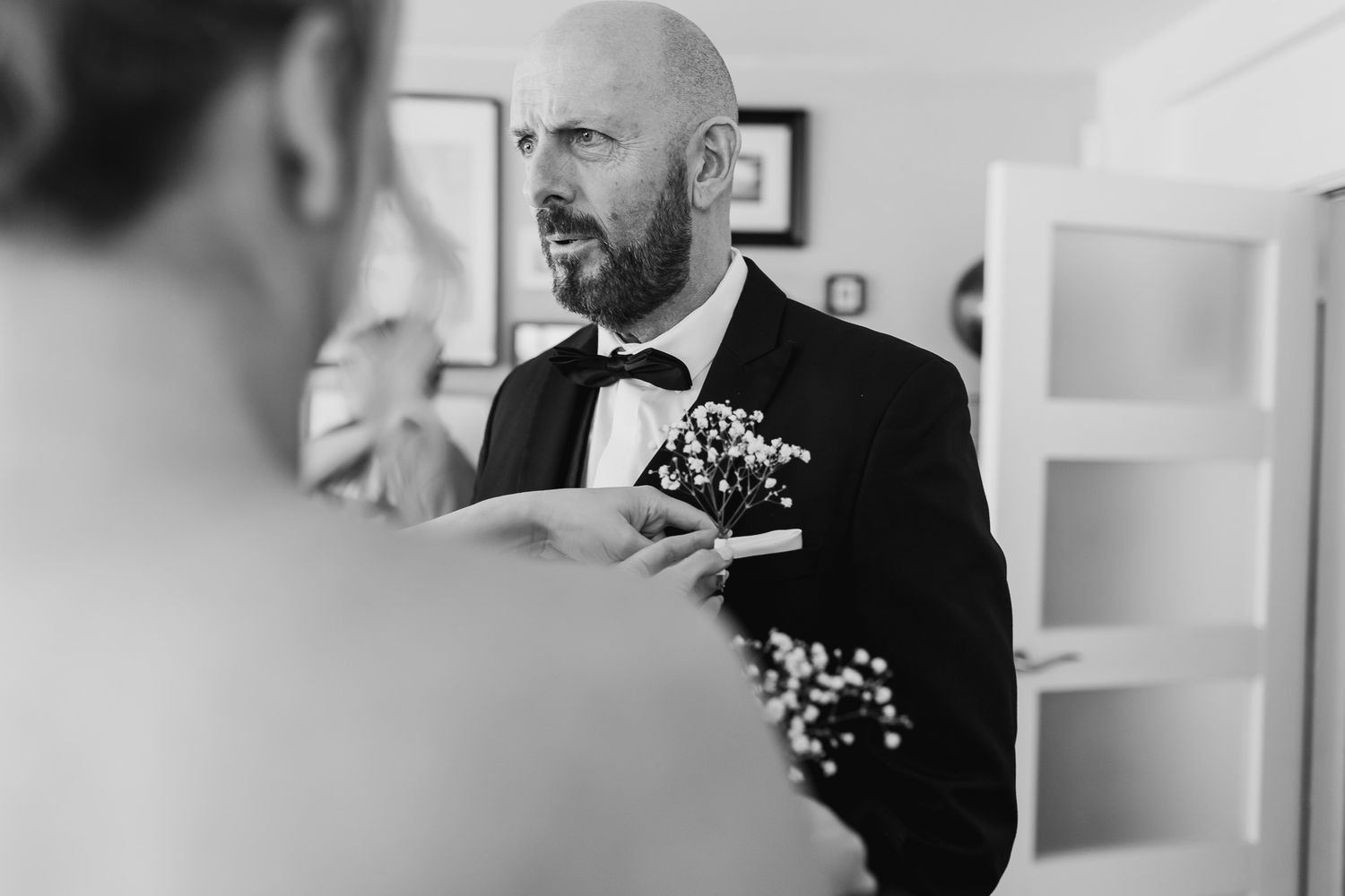 Black and white candid shots of Dublin wedding preparations and conversations.