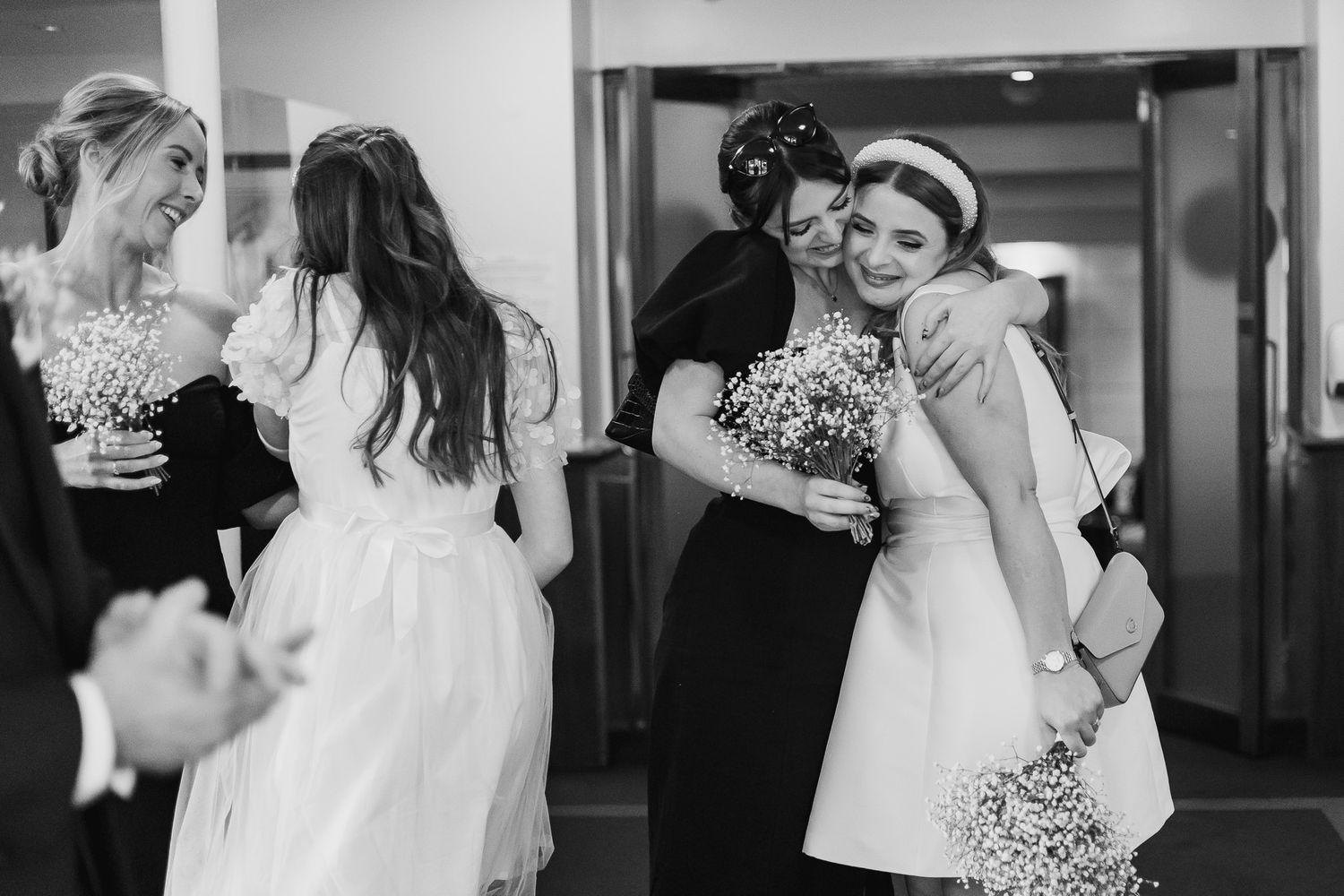 Wedding celebration candid moments captured in black and white photography.