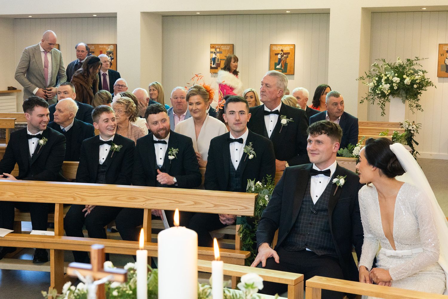 Wedding guests seated in rows watching ceremony proceedings at Dublin wedding.