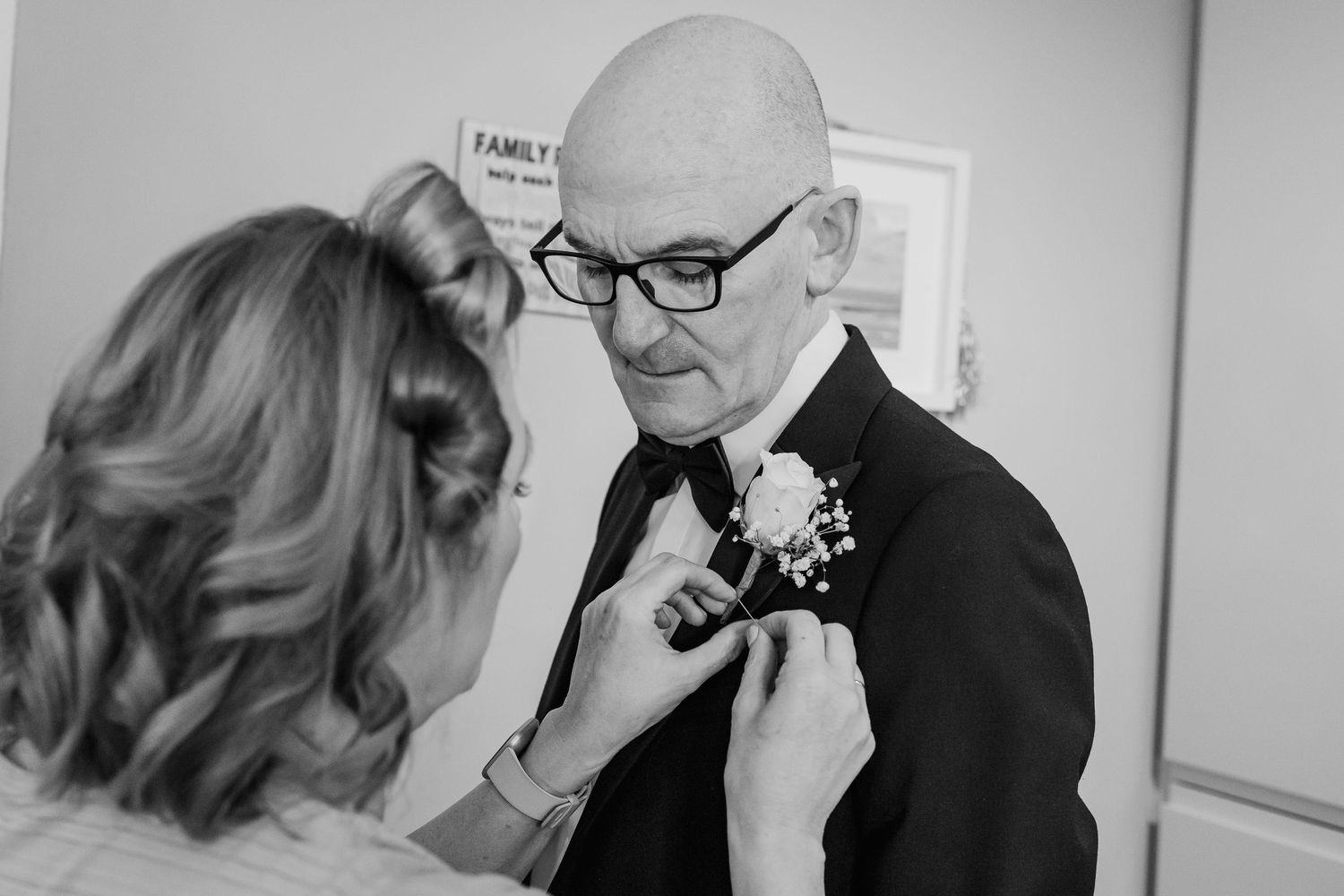 Black and white photos of people interacting at a formal gathering.