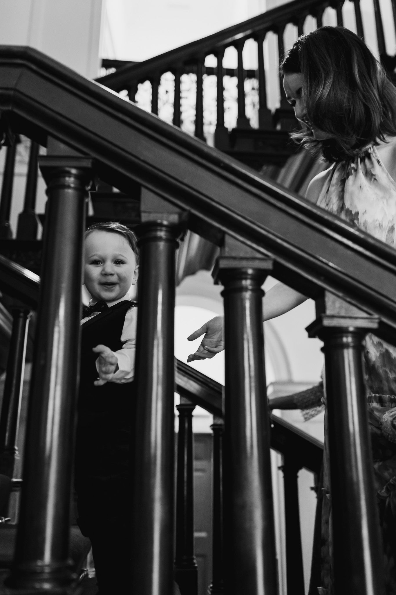 Black and white photo of decorative staircase bannisters creating dramatic shadows and lines in MoLI Dublin City