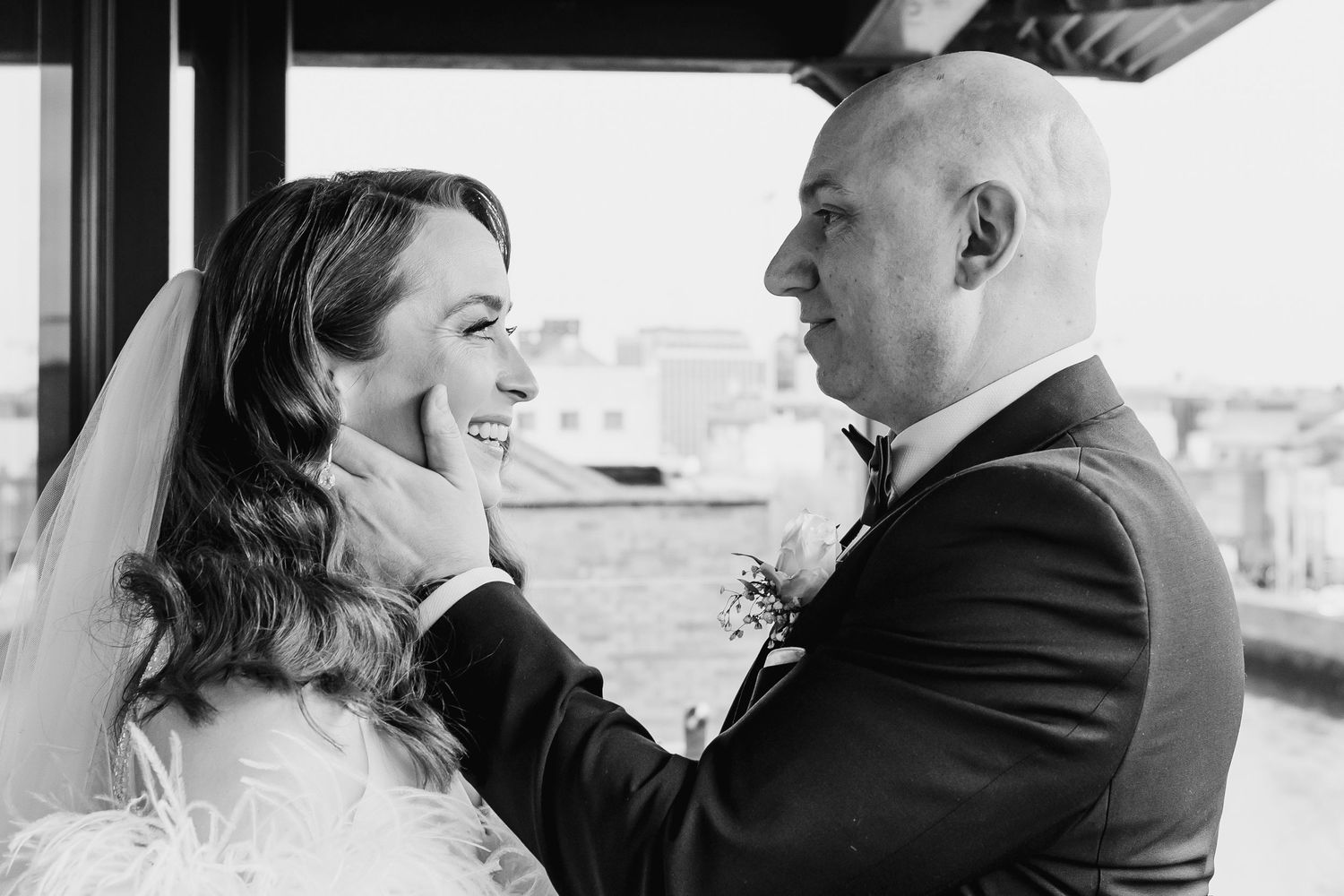Black and white wedding photo series showing intimate moments between newlyweds.