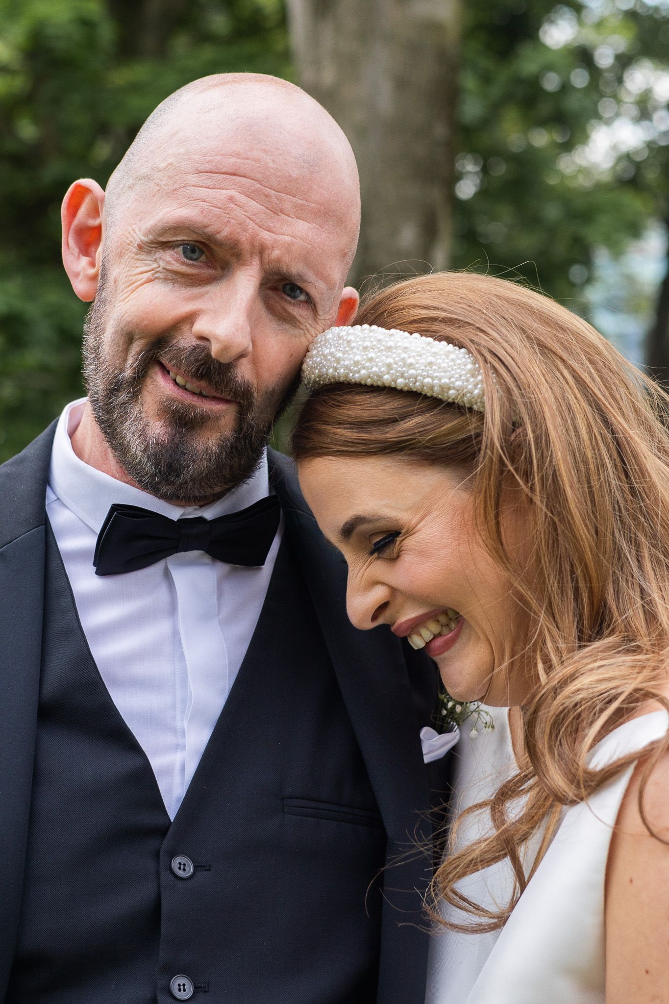 Close-up romantic wedding portraits showing tender moments between newlyweds.