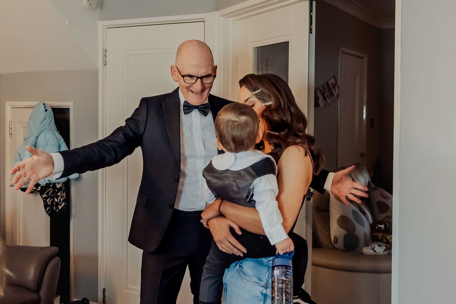 Candid moments captured during a formal event showing interactions between guests.