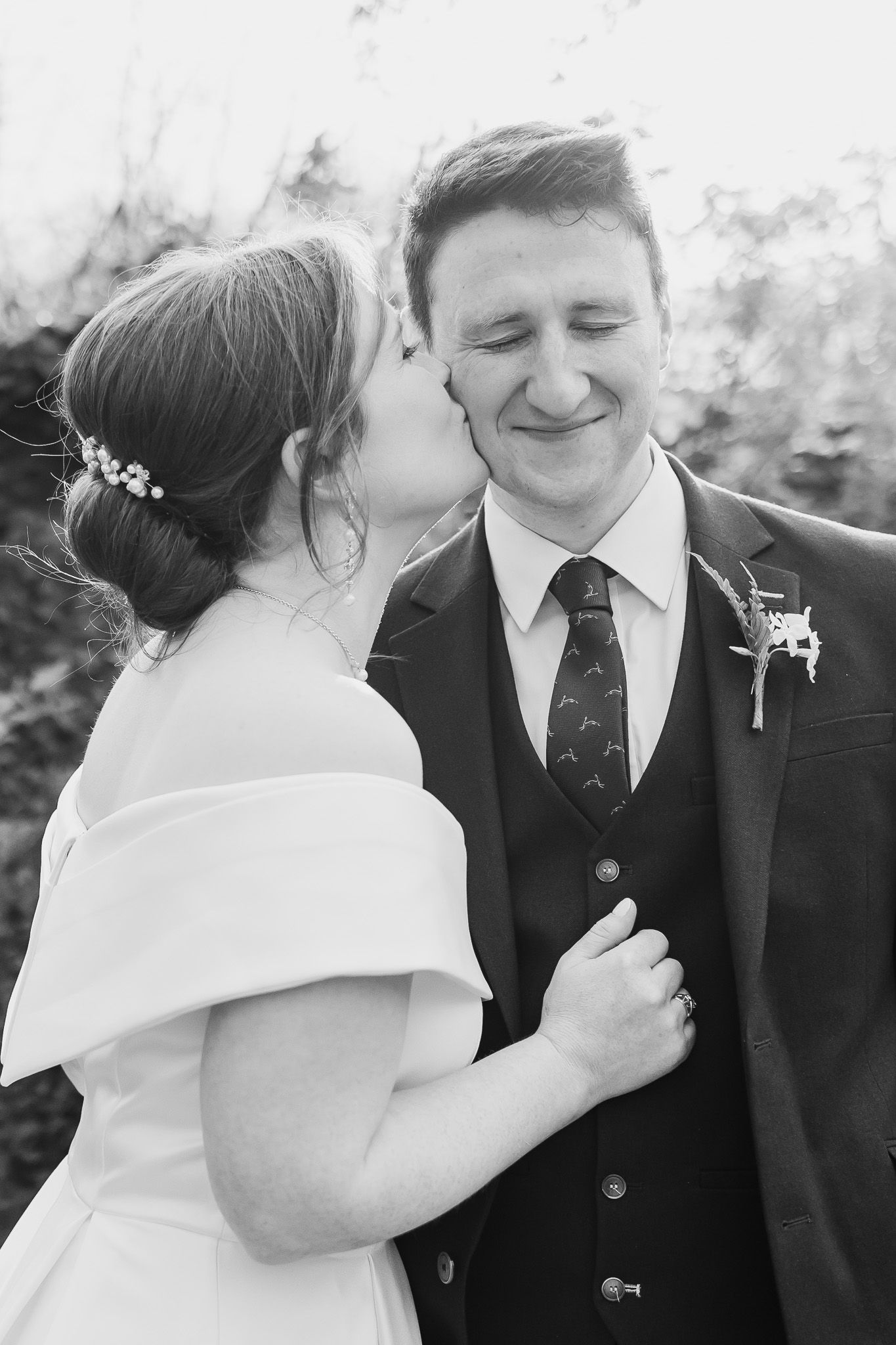 Black and white natural intimate wedding portraits showing tender moments between newlyweds during Dublin City wedding.