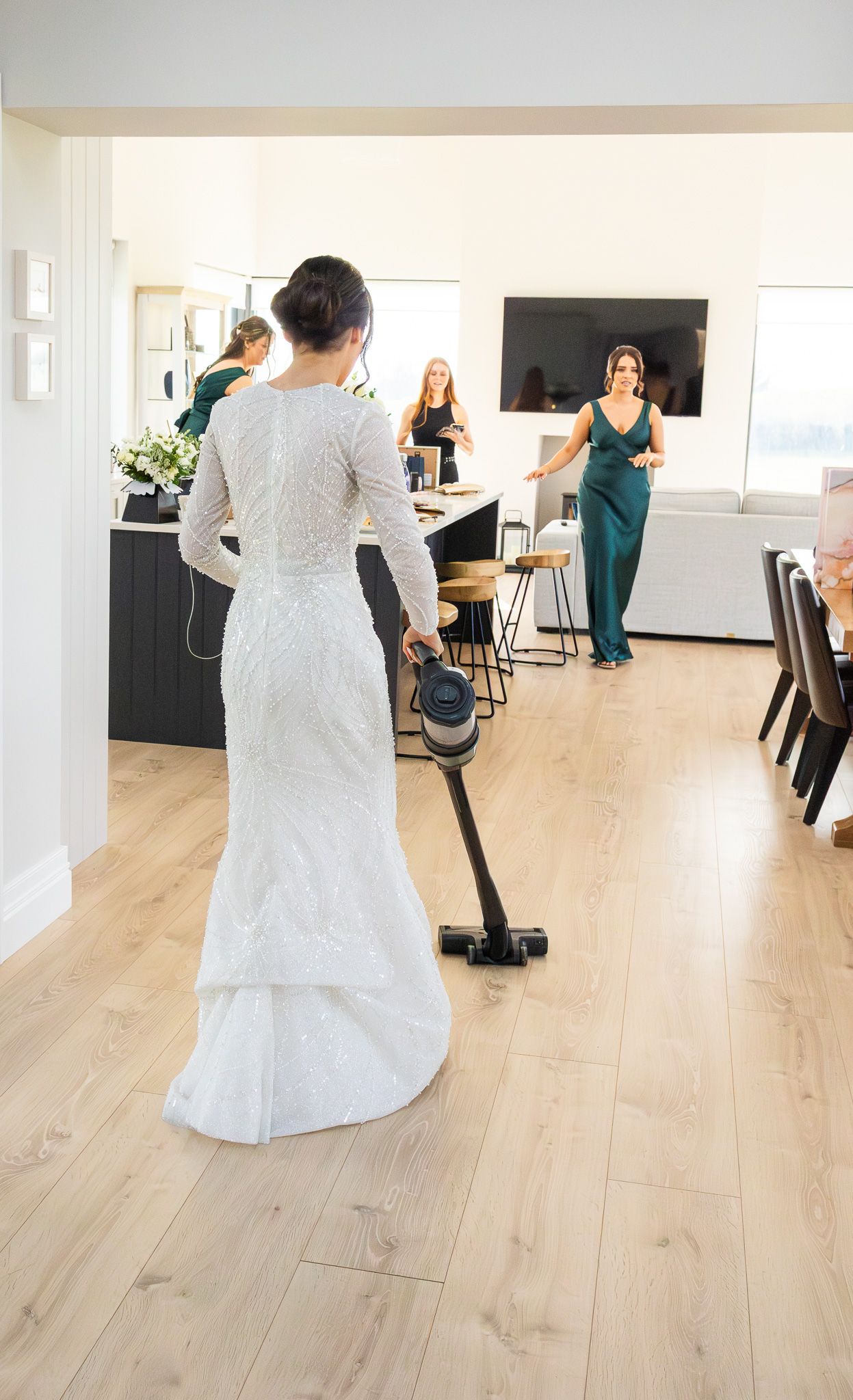 Wedding dress shots from behind showing the train on light wooden flooring taken by Laura Conlon Dublin wedding photographer