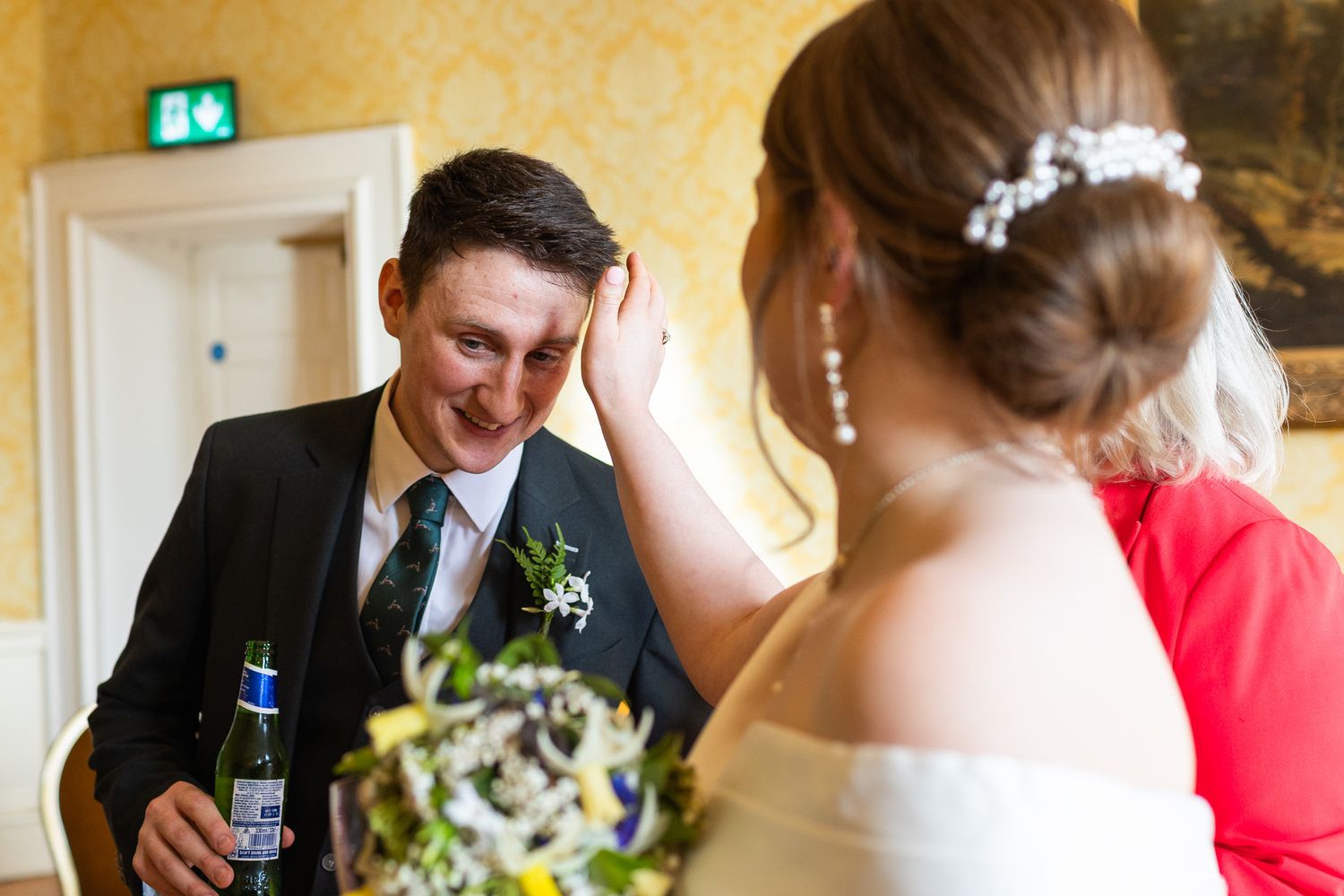 Wedding guests gather in the ornate MoLI  venue in Dublin City centre with decorative lighting and elegant decor.