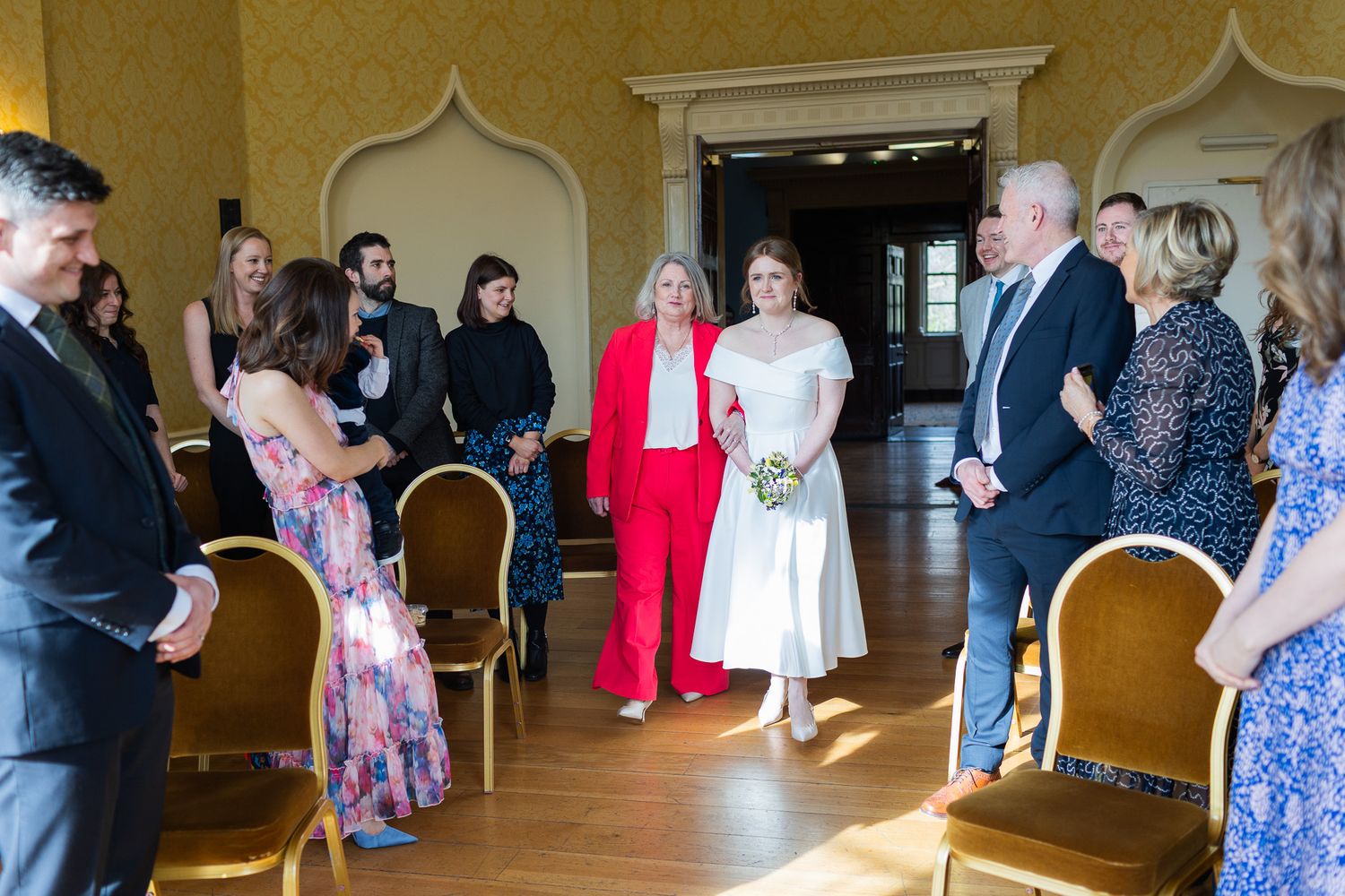 Dublin CIty wedding in MoLI 's ornate room with gold damask wallpaper and classic architectural details.