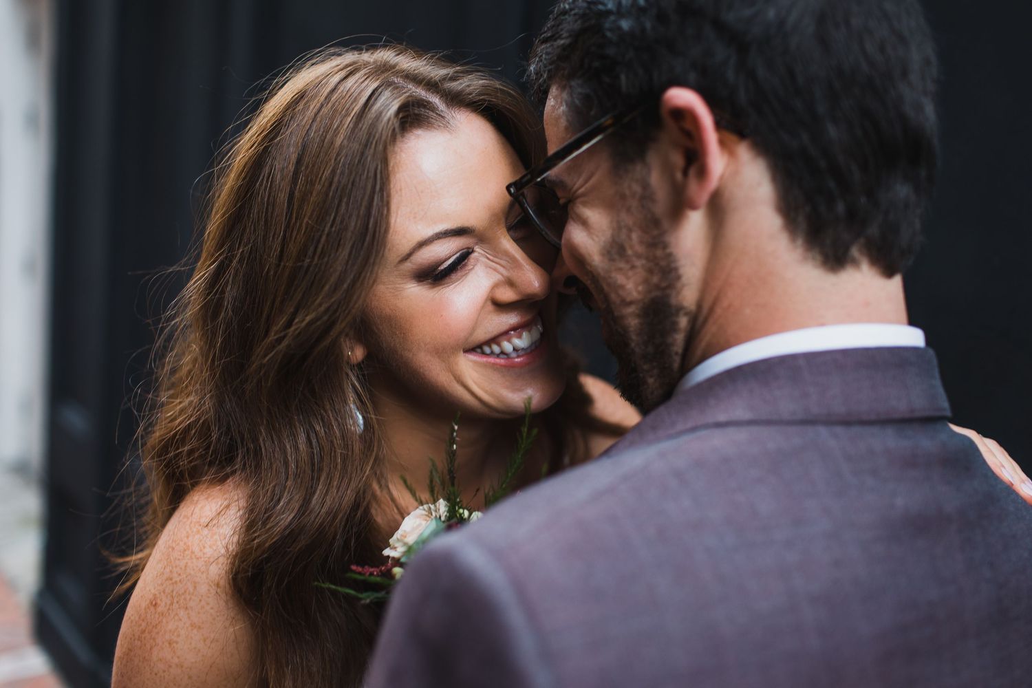 A couple shares a candid moment together during their wedding photoshoot.