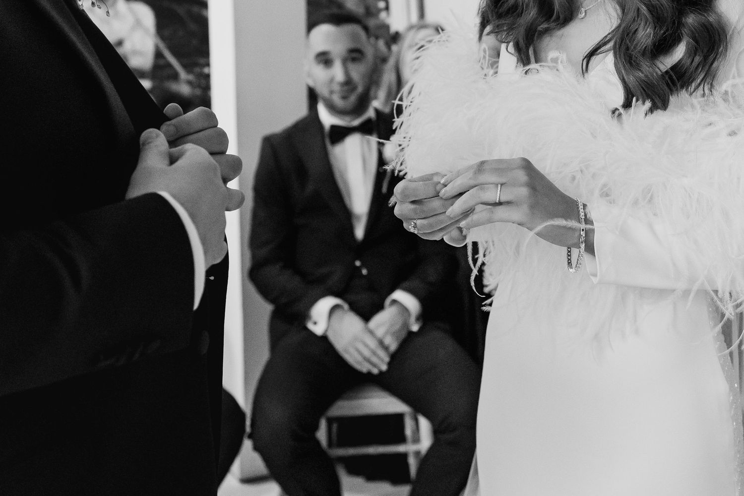 Black and white candid shots capture genuine moments during an elegant wedding reception.