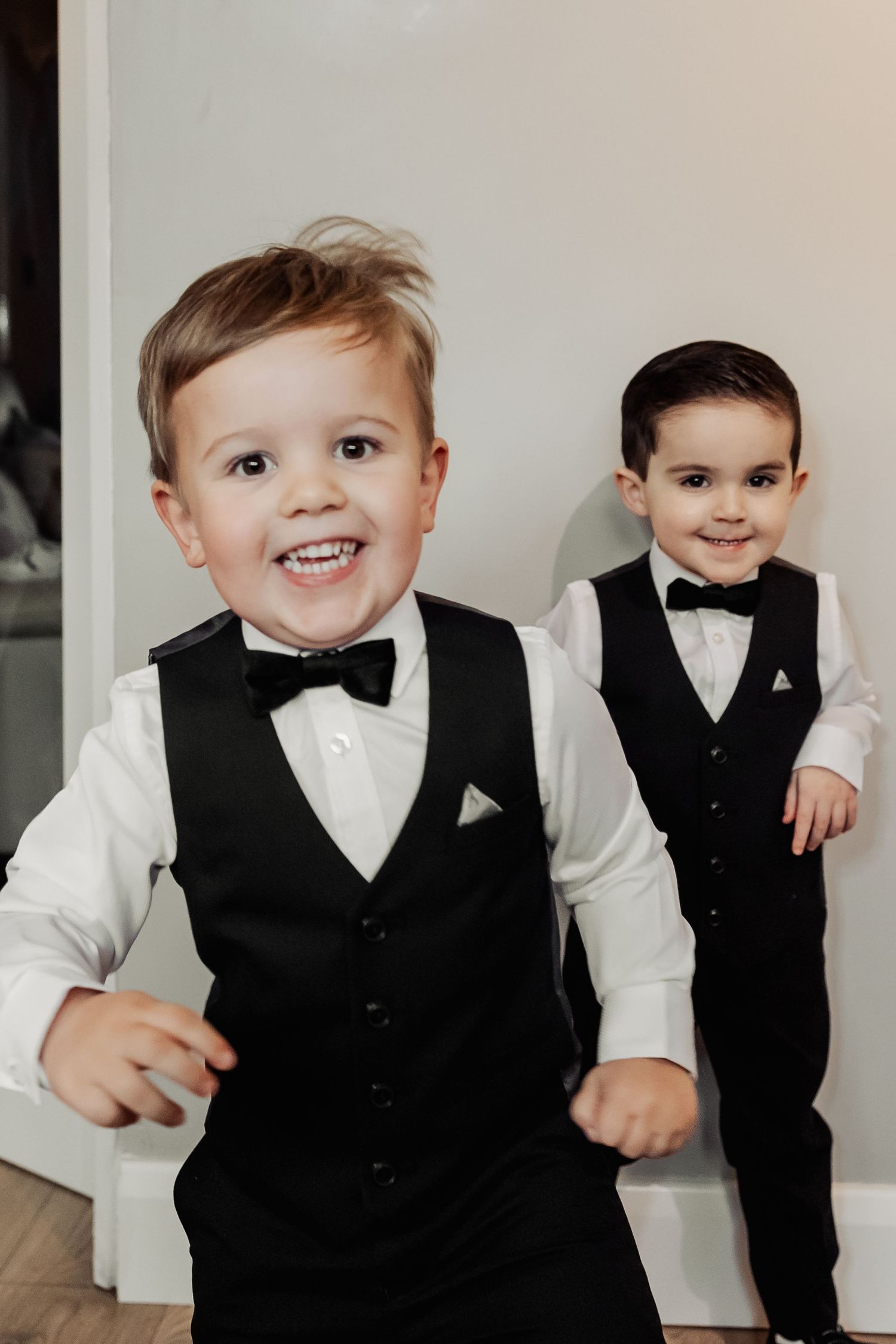 Collection of formal portraits showing little ones dressed in black vests and bow ties.