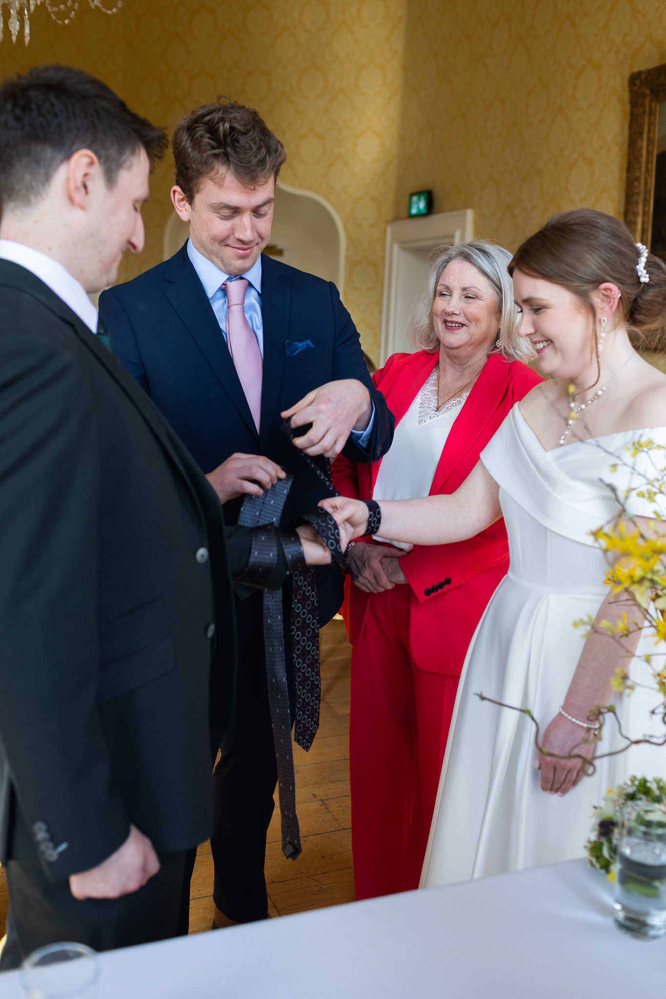 Wedding celebration in a MoLI  Dublin city venue with guests in formal attire gathering around decorative tables.